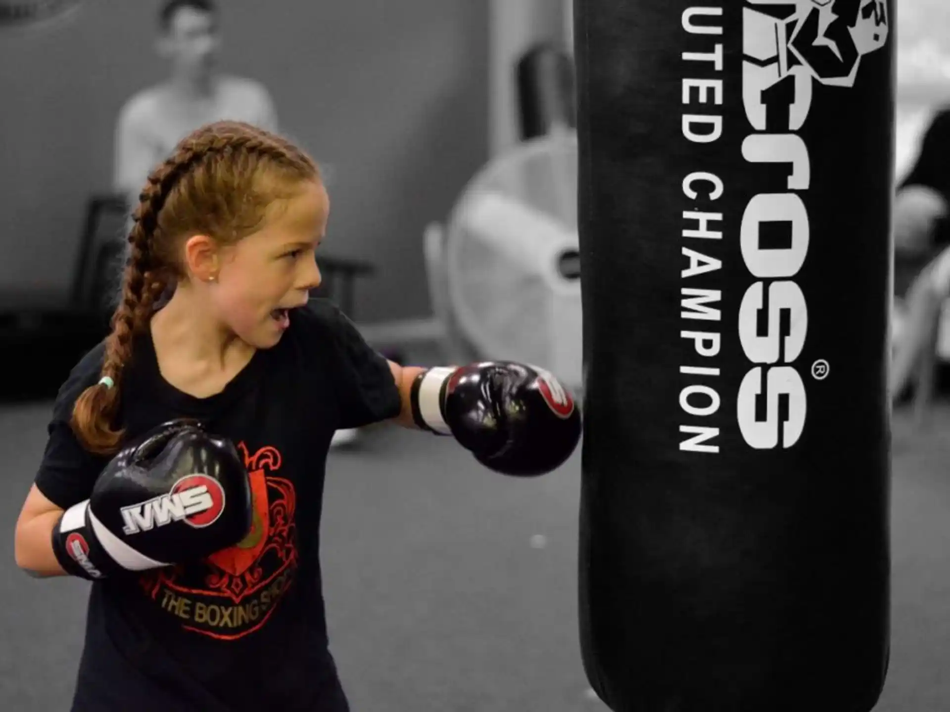 a girl wearing boxing gloves