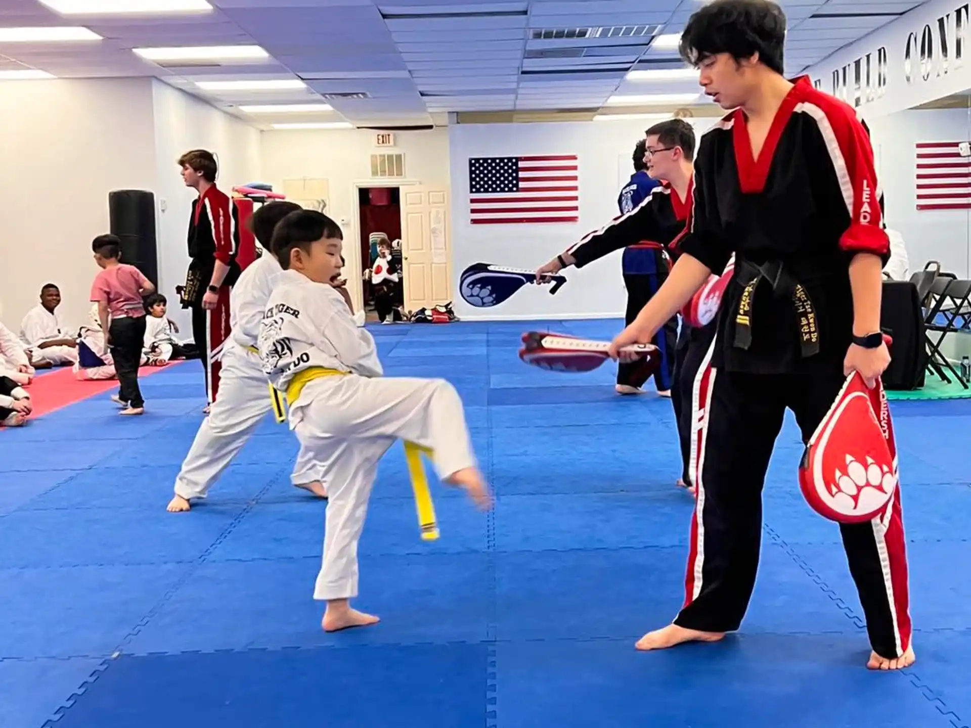 a group of people in karate uniforms