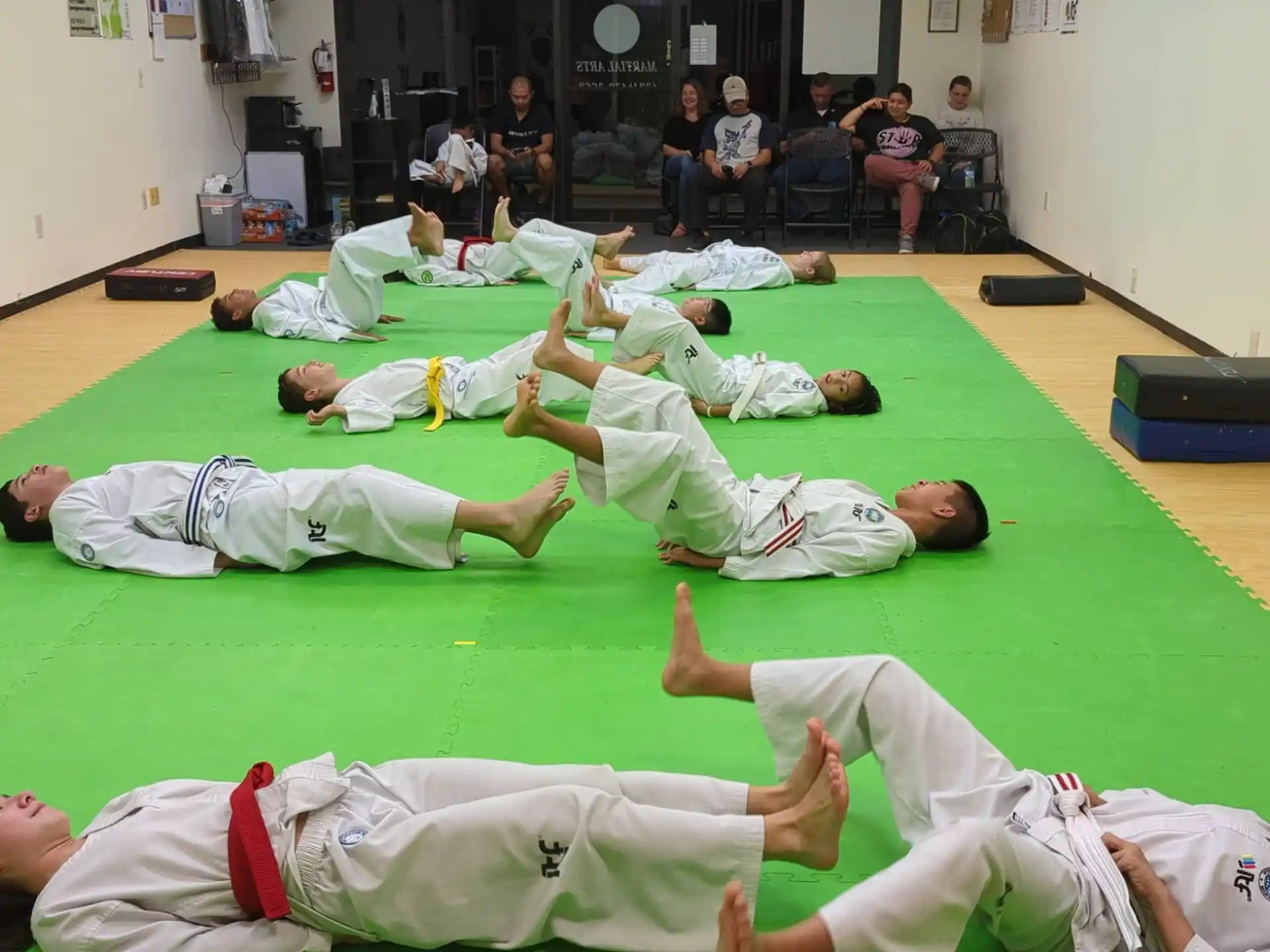 a group of people in karate uniforms