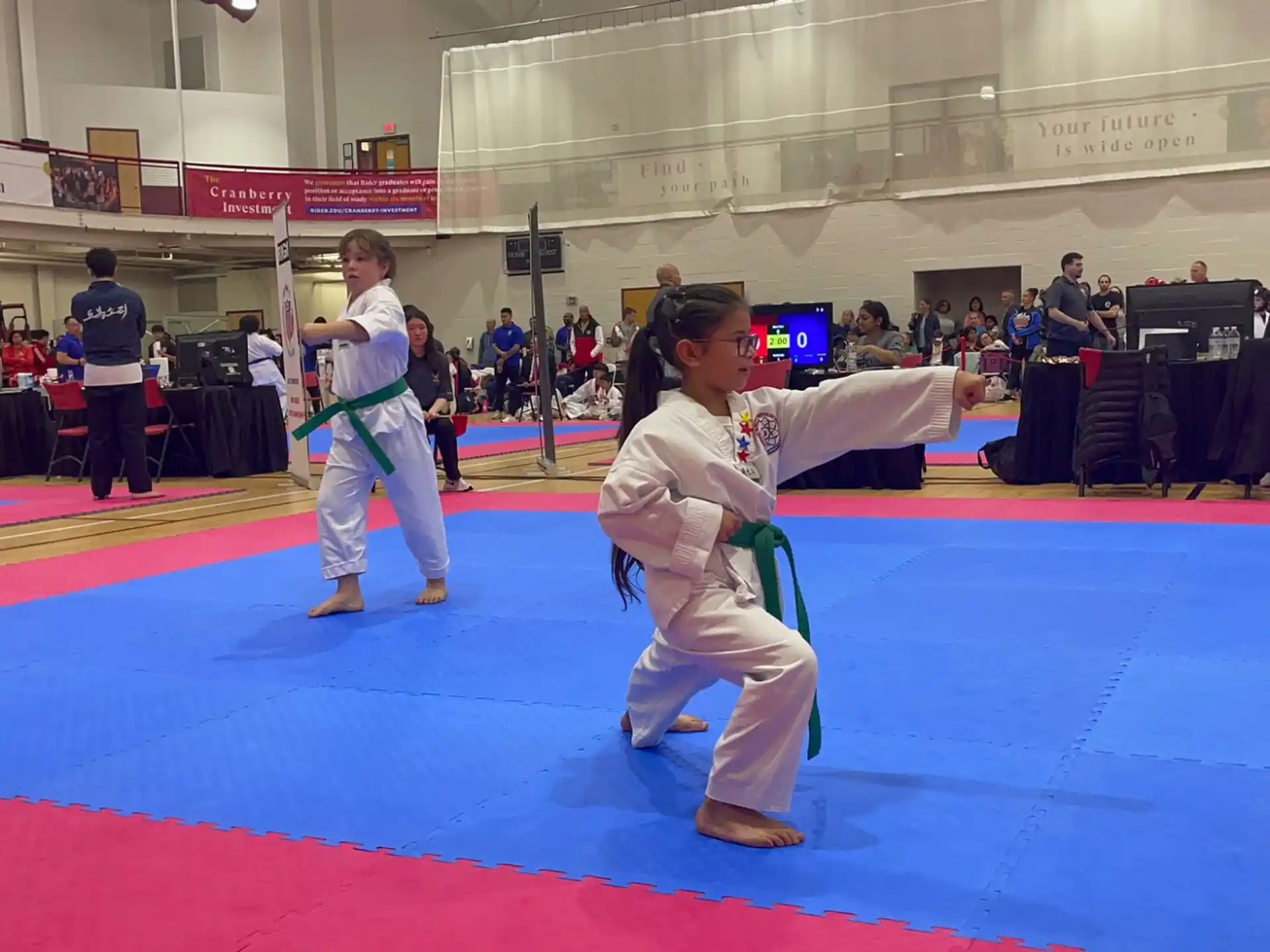 a couple of people in karate uniforms