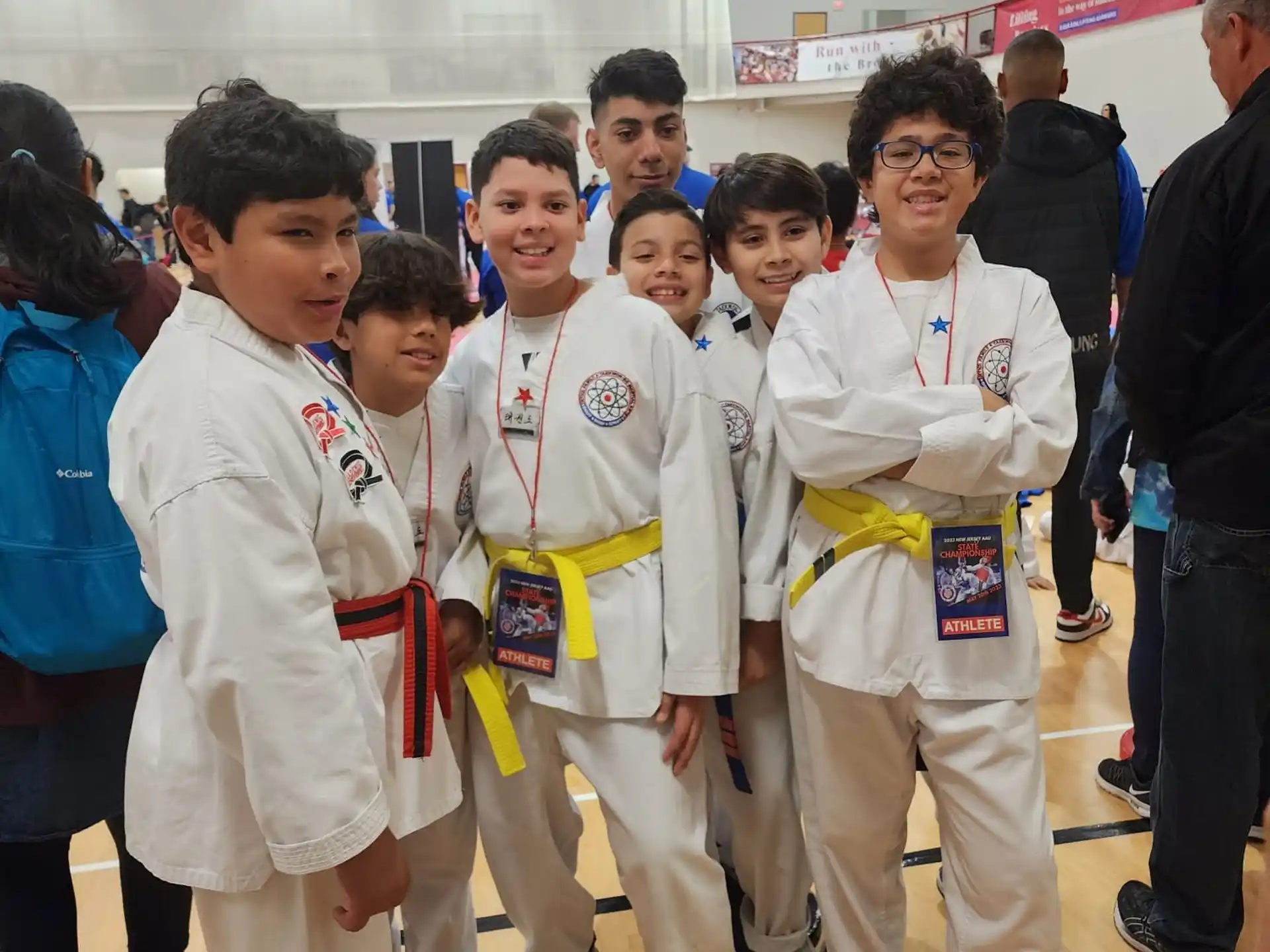 a group of people in white karate uniforms