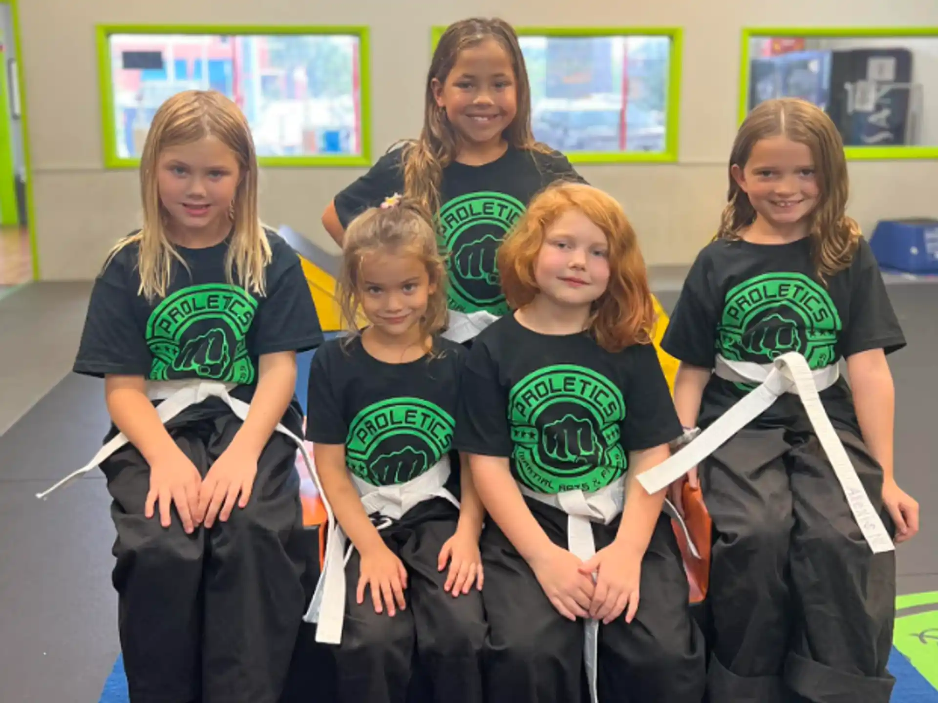 a group of girls posing for a photo