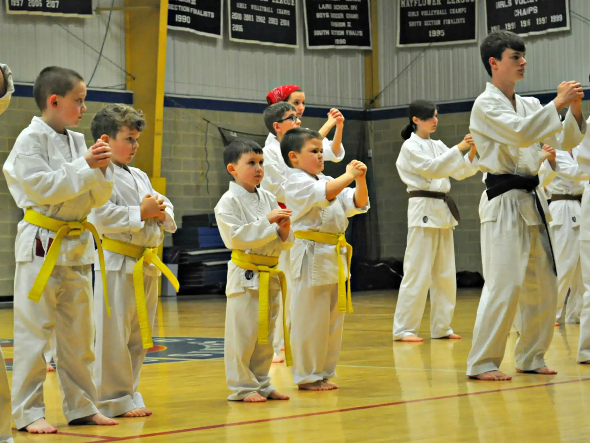 a group of boys in karate uniforms