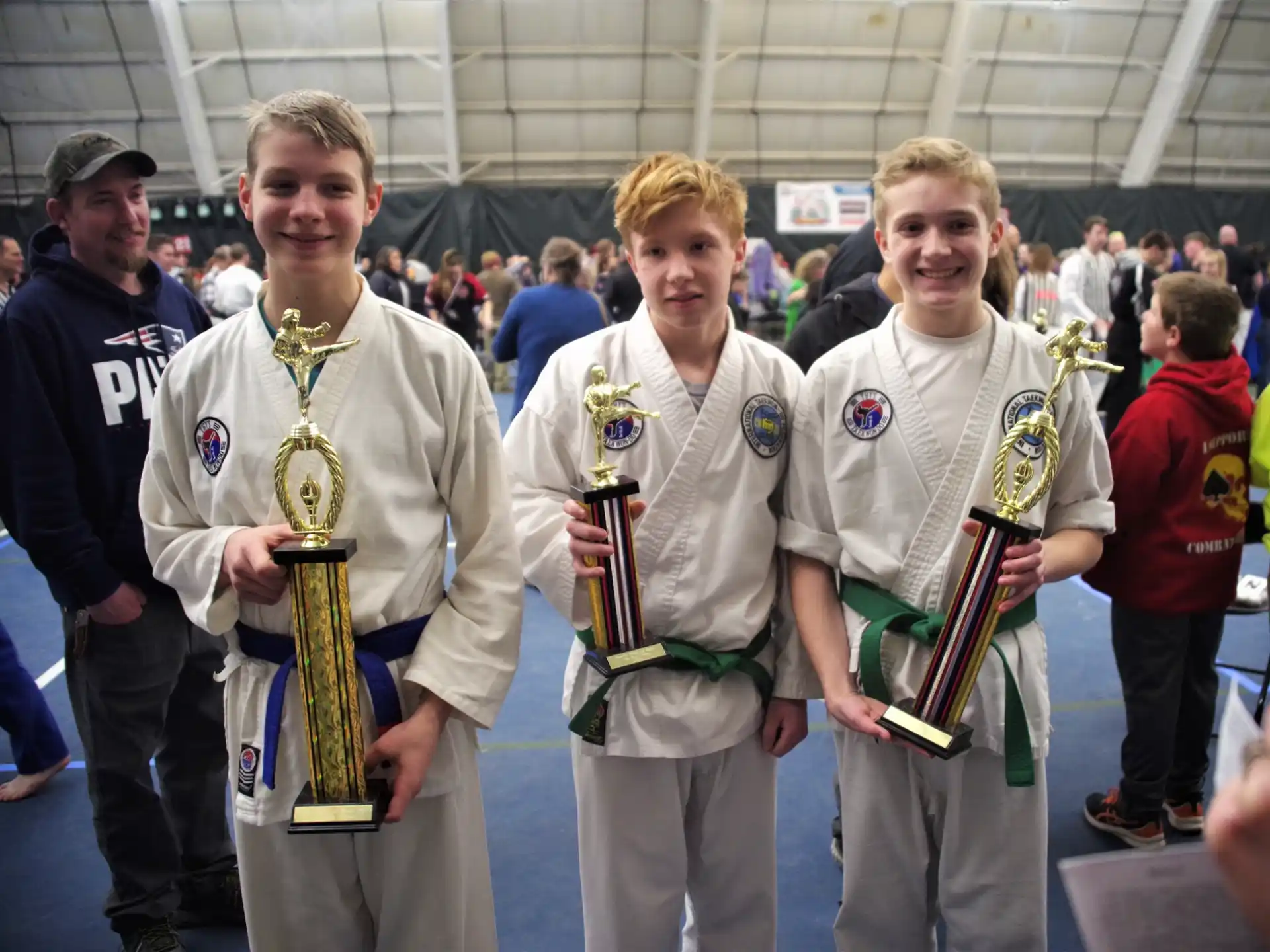 a group of people holding trophies