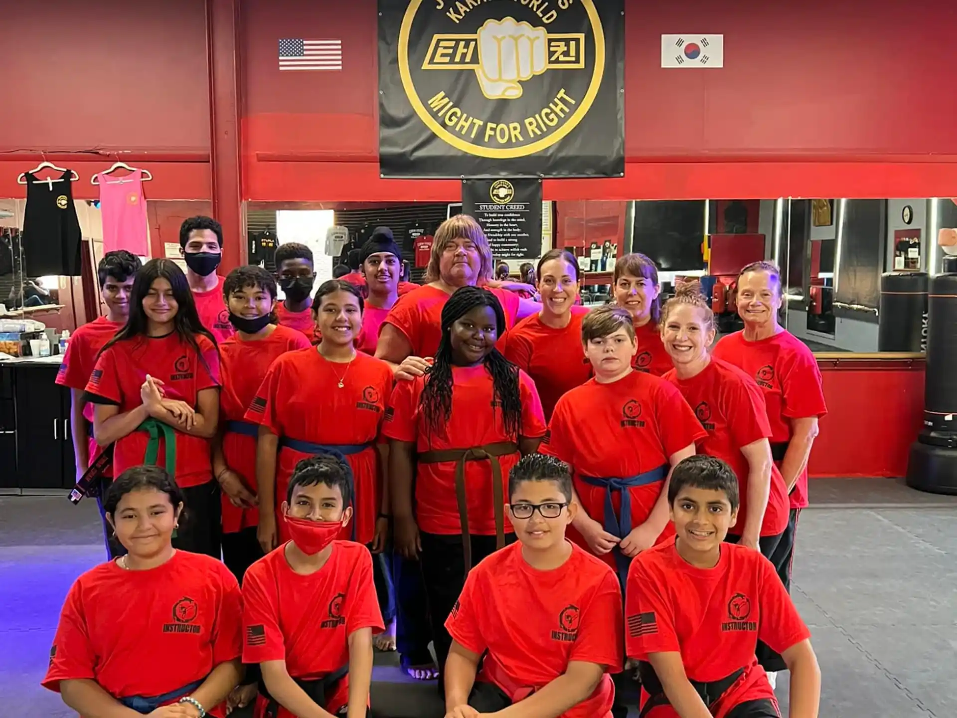 a group of people wearing red shirts