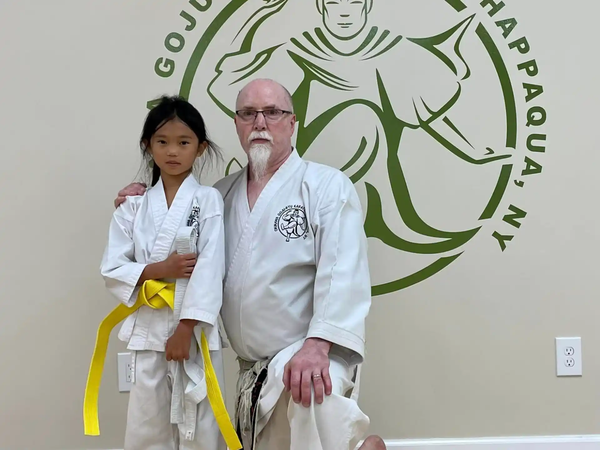 a man and a woman in white karate uniforms