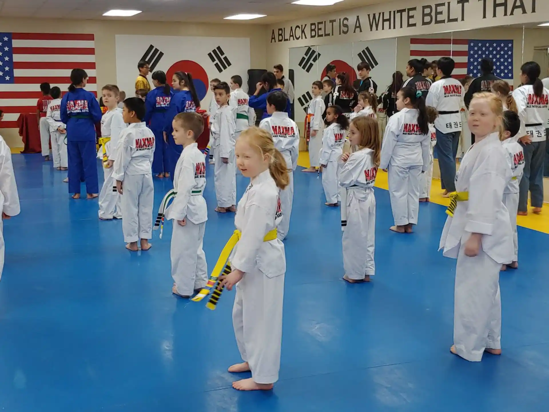 a group of people in karate uniforms