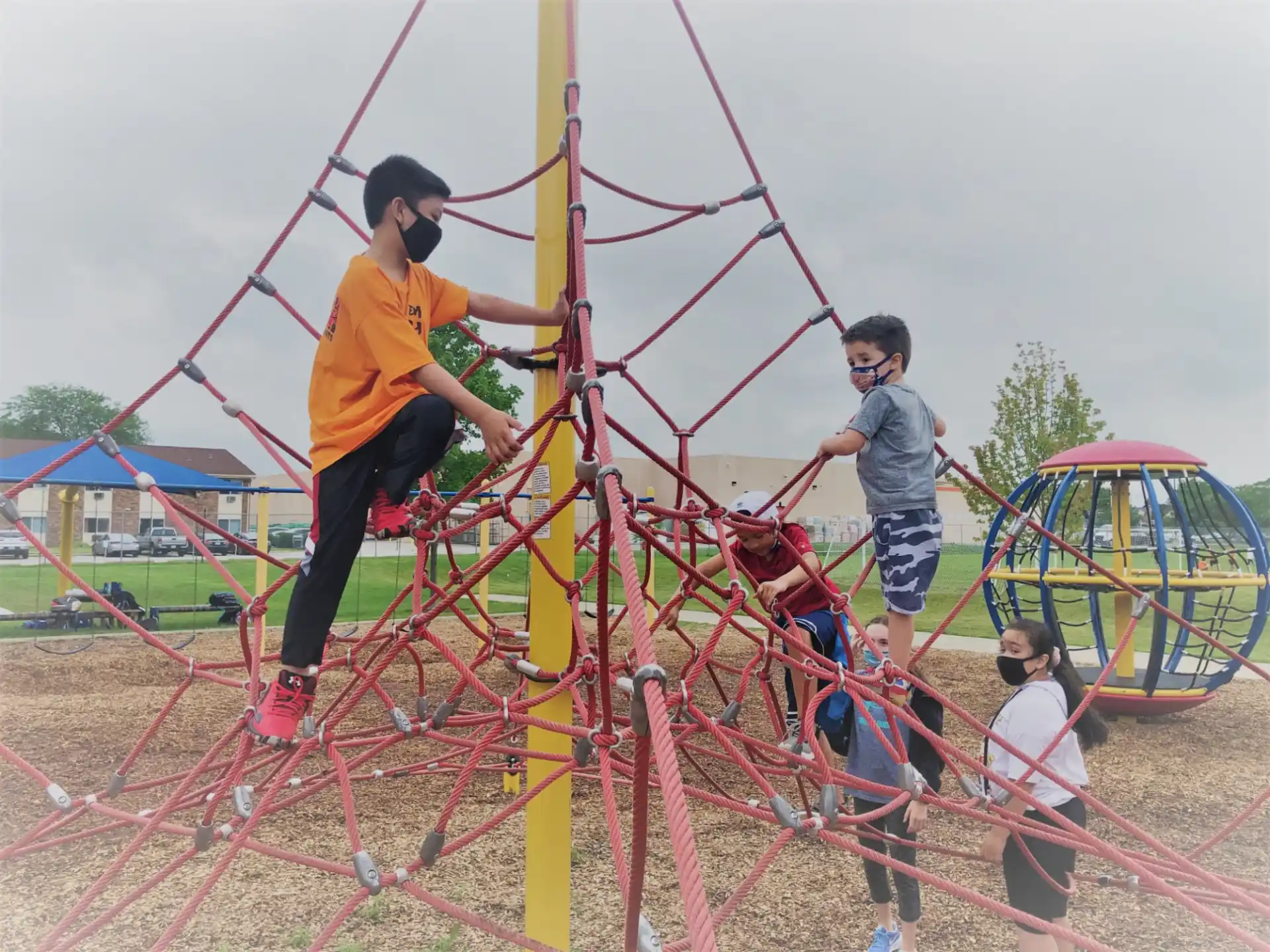 a group of people playing on a playground