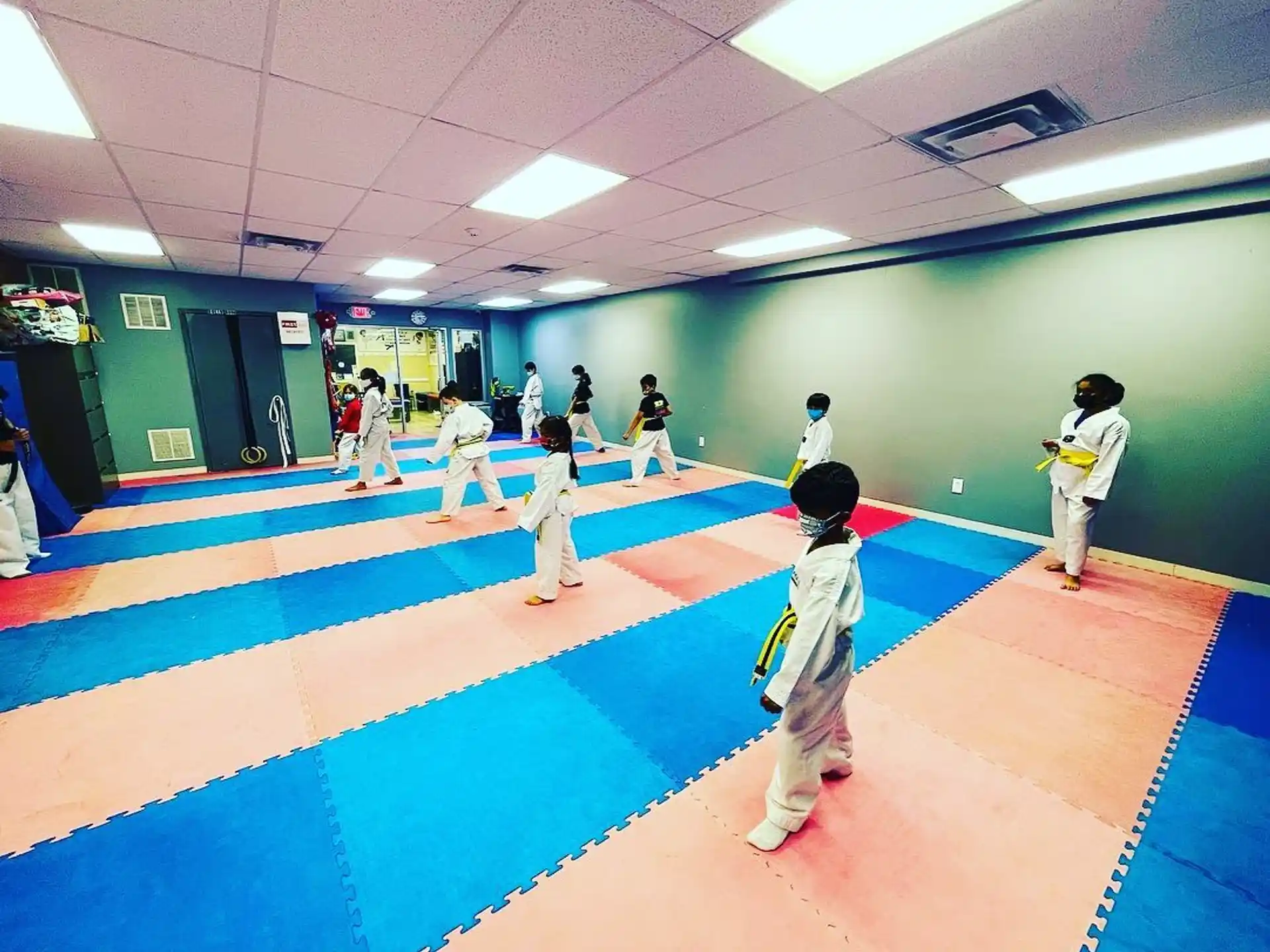 a group of people in karate uniforms