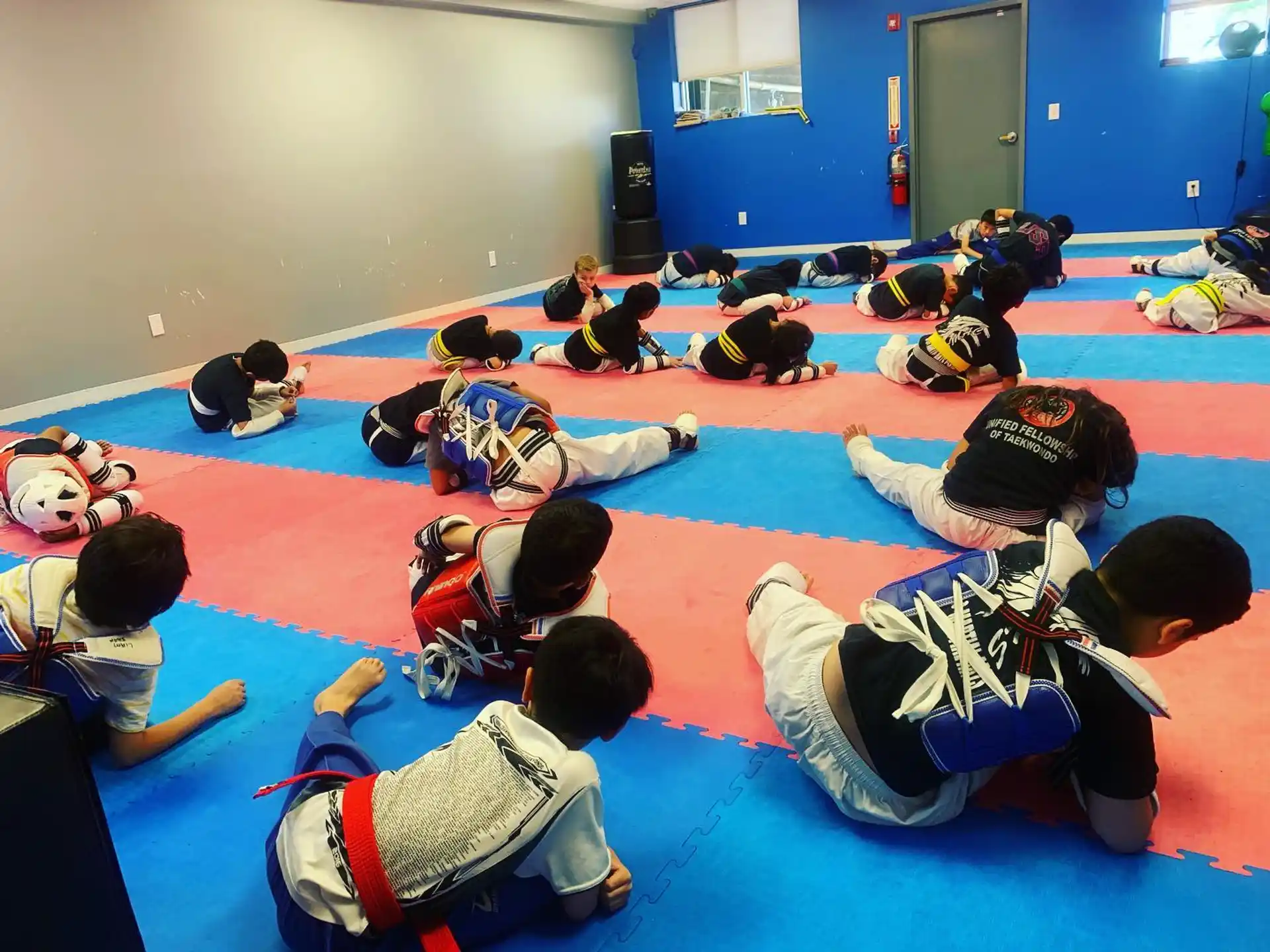a group of people kneeling on the floor