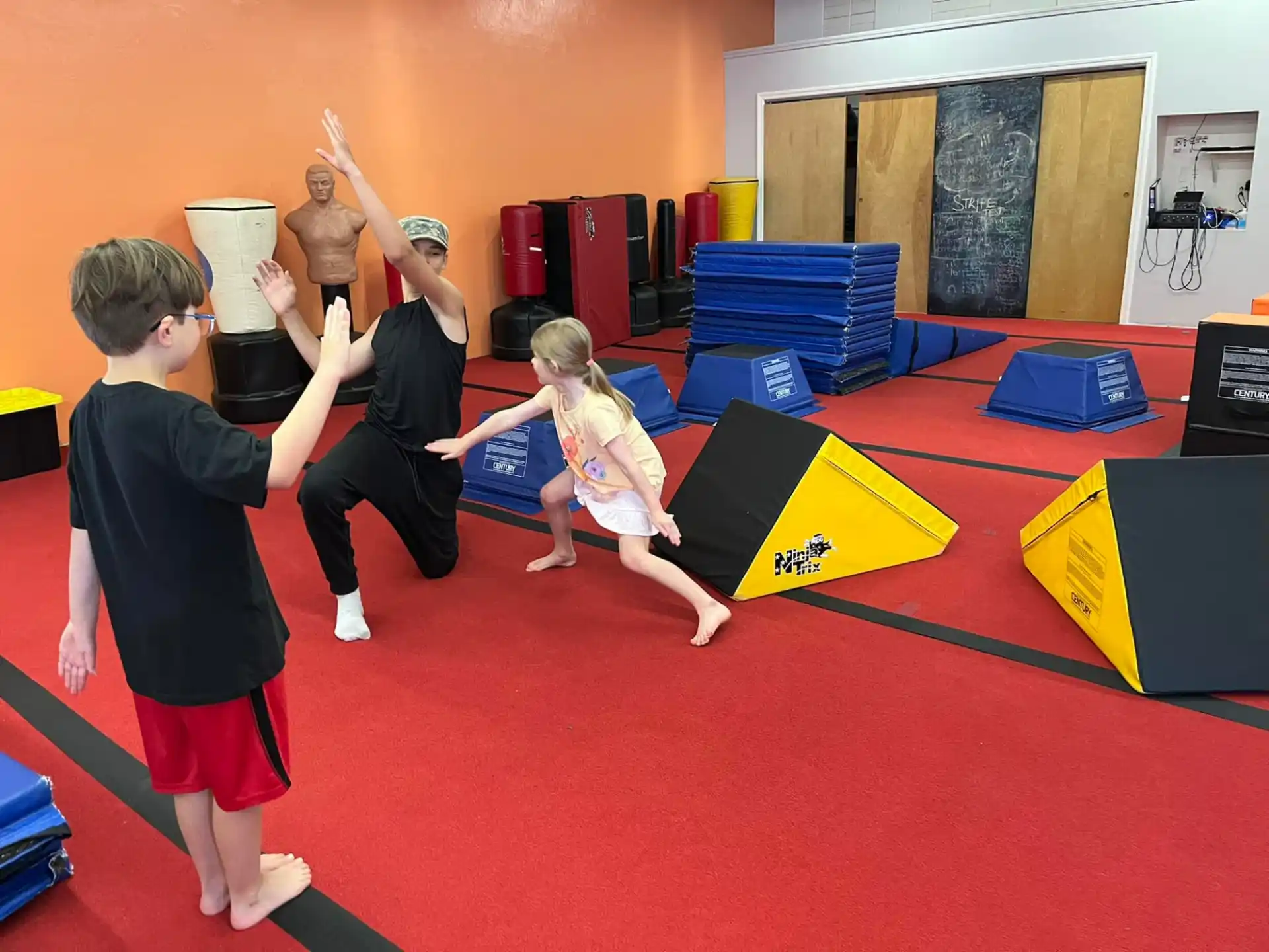 a group of children playing on a mat