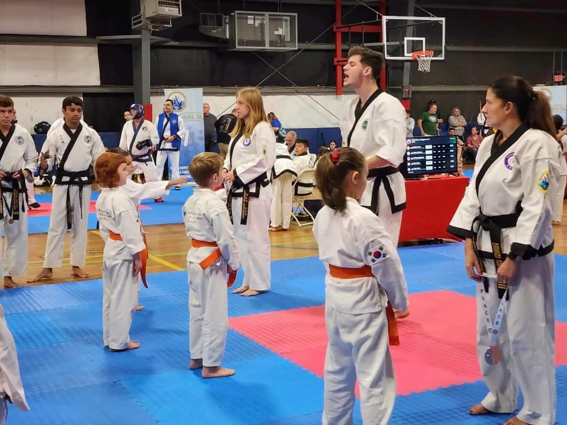 a group of people in karate uniforms
