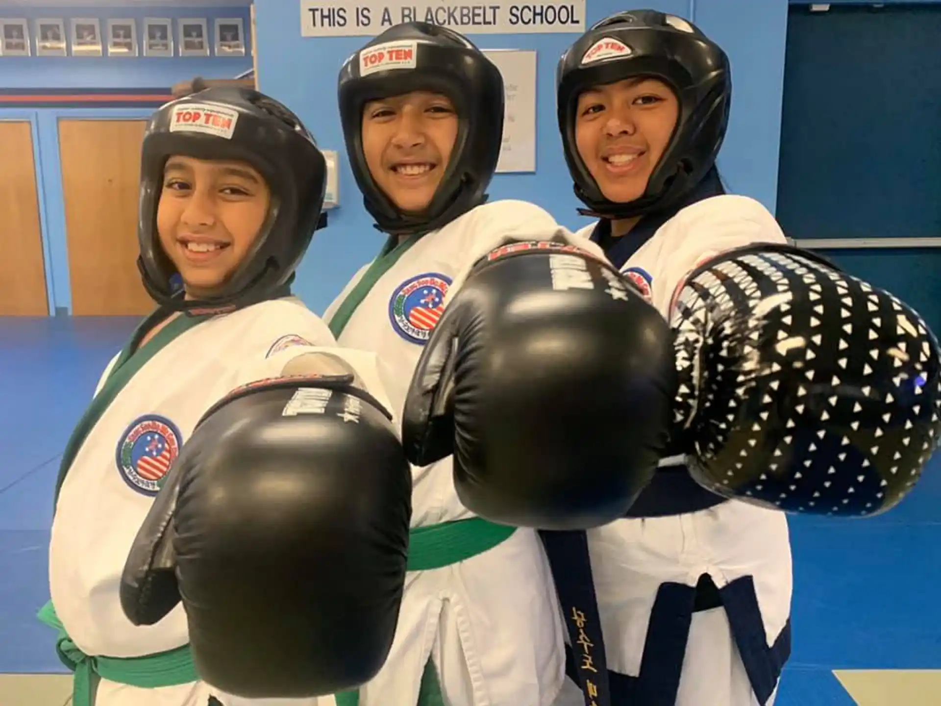 a group of people wearing helmets and holding helmets