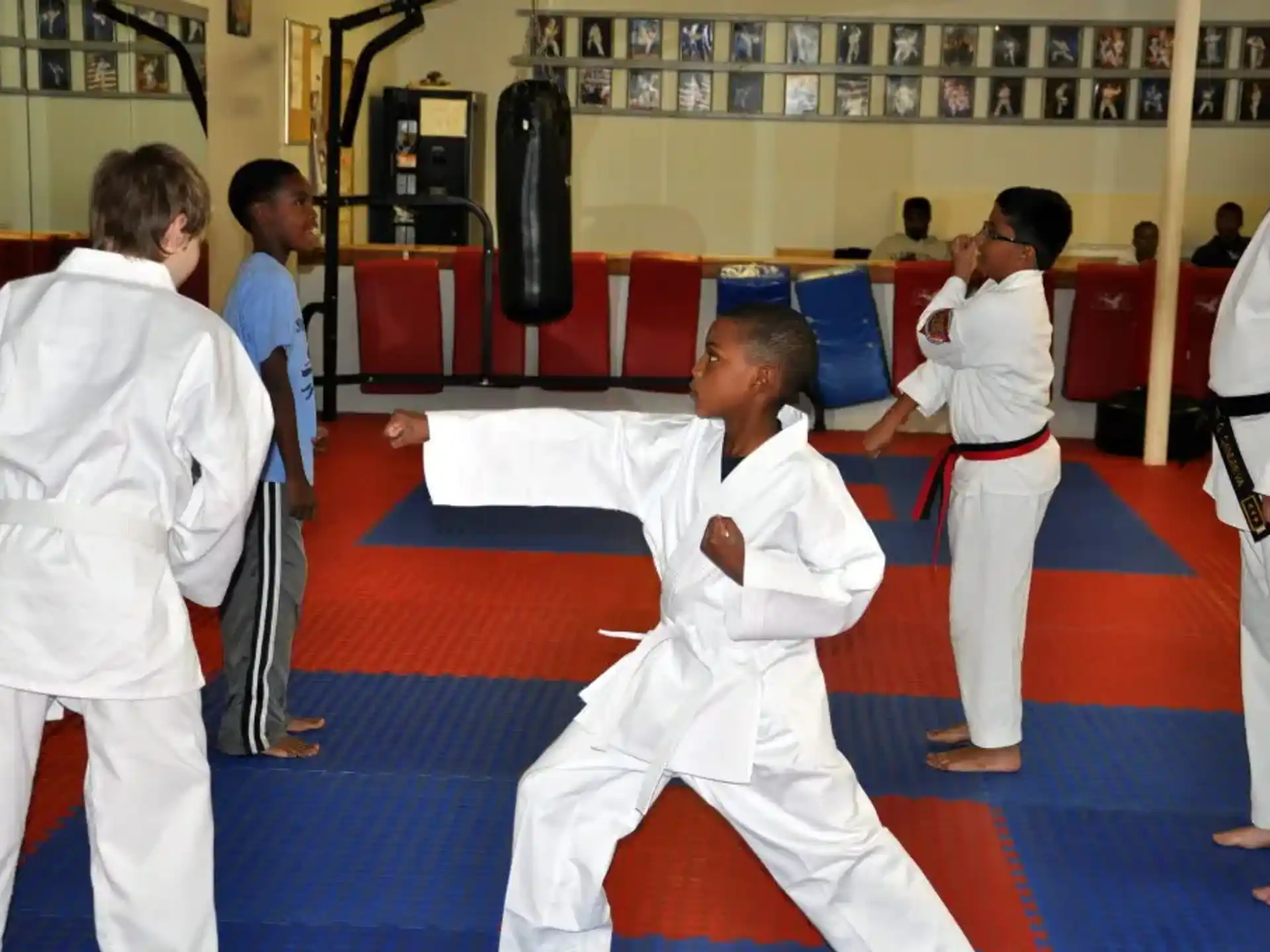 a group of people in karate uniforms