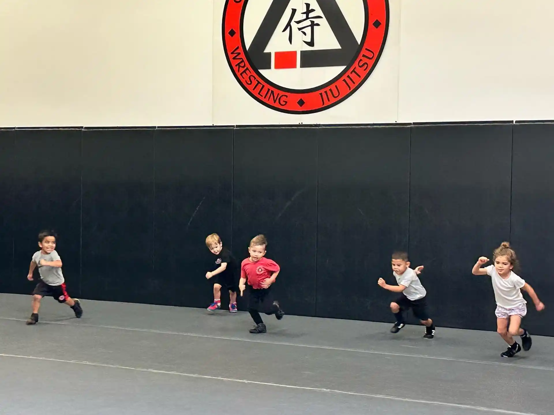 a group of kids playing basketball