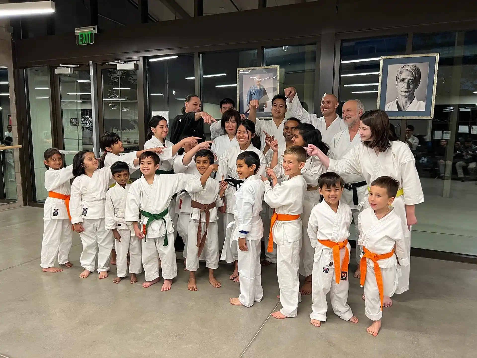 a group of people in karate uniforms