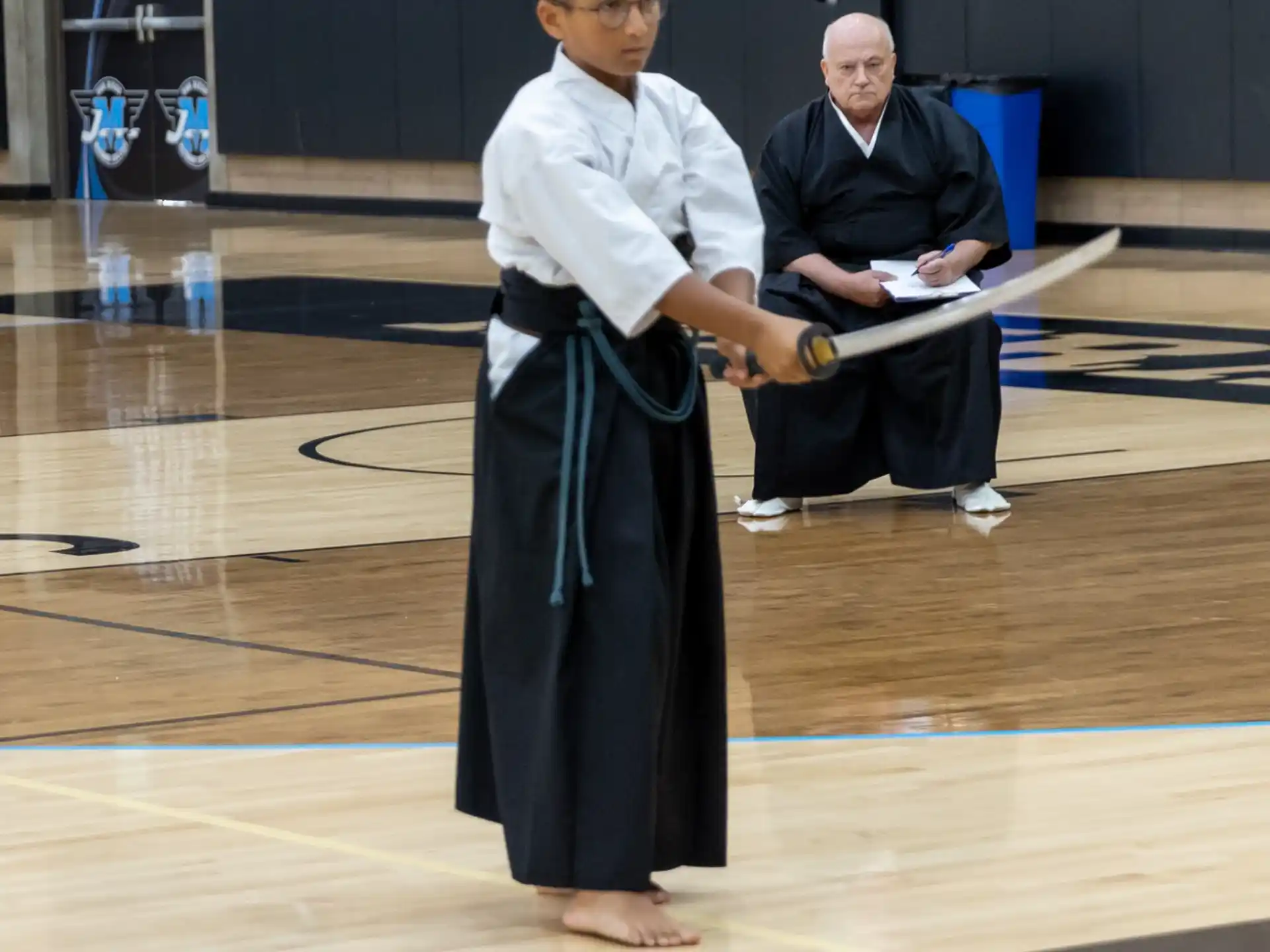 a man in a black robe and a man in a white robe