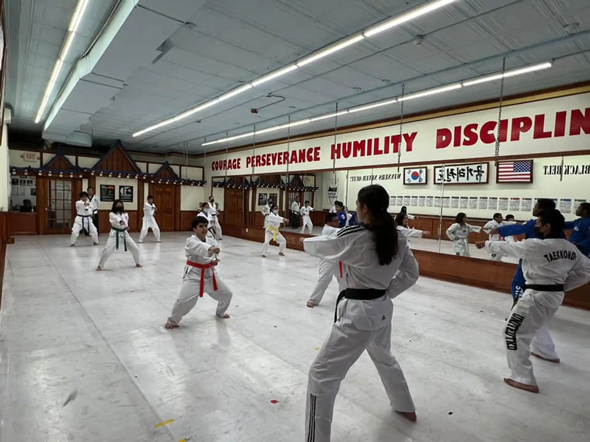 a group of people in karate uniforms