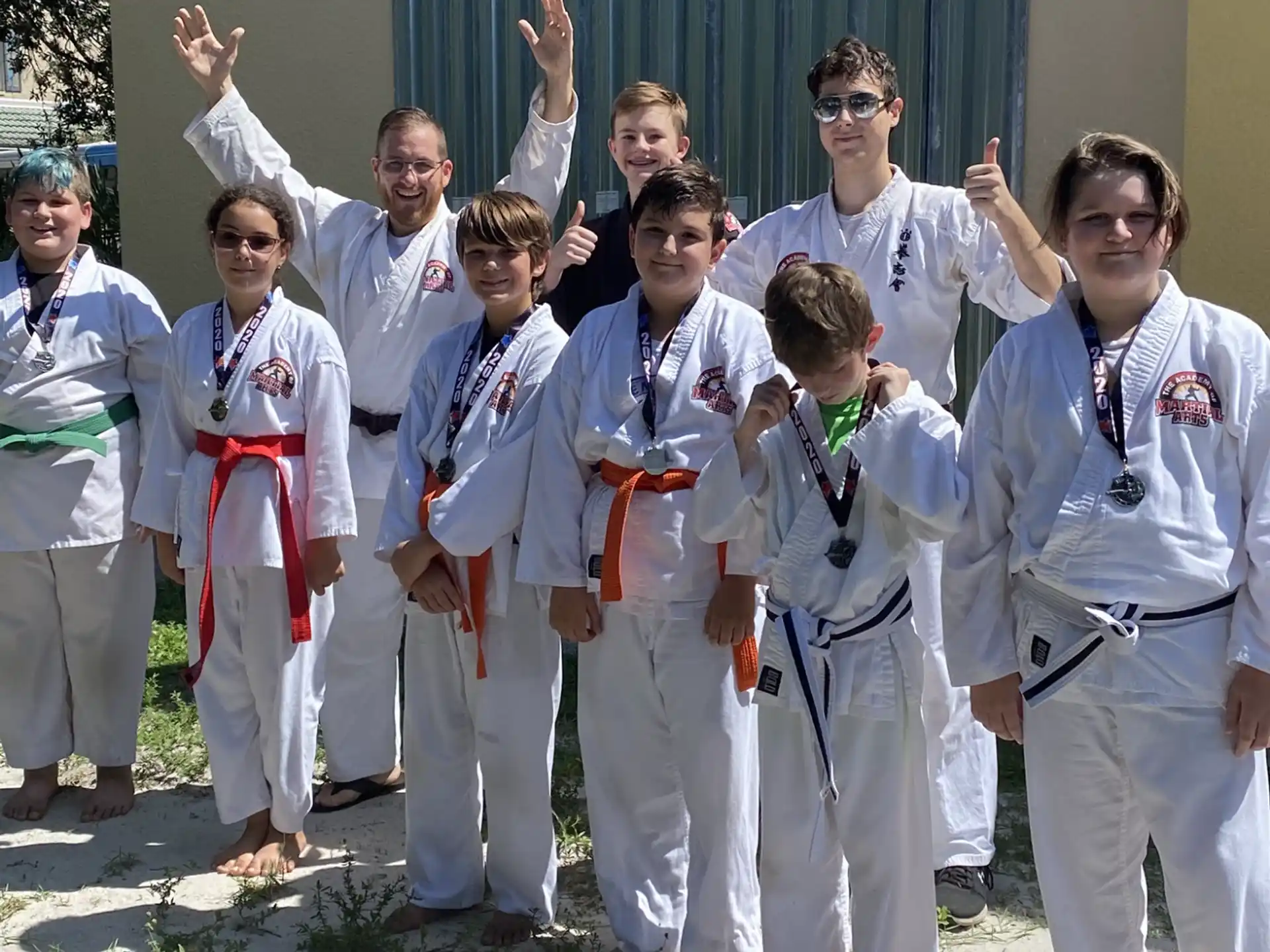 a group of people in karate uniforms