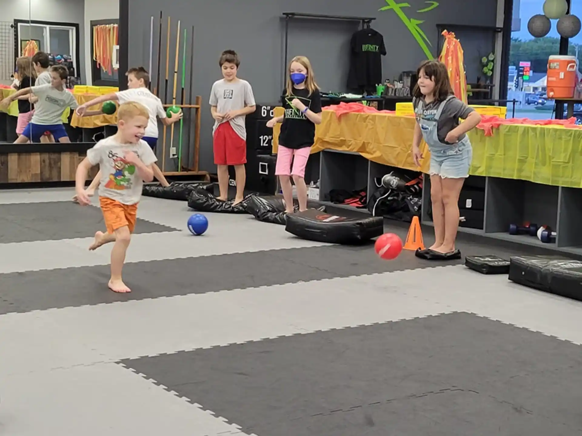 a group of people playing with balls