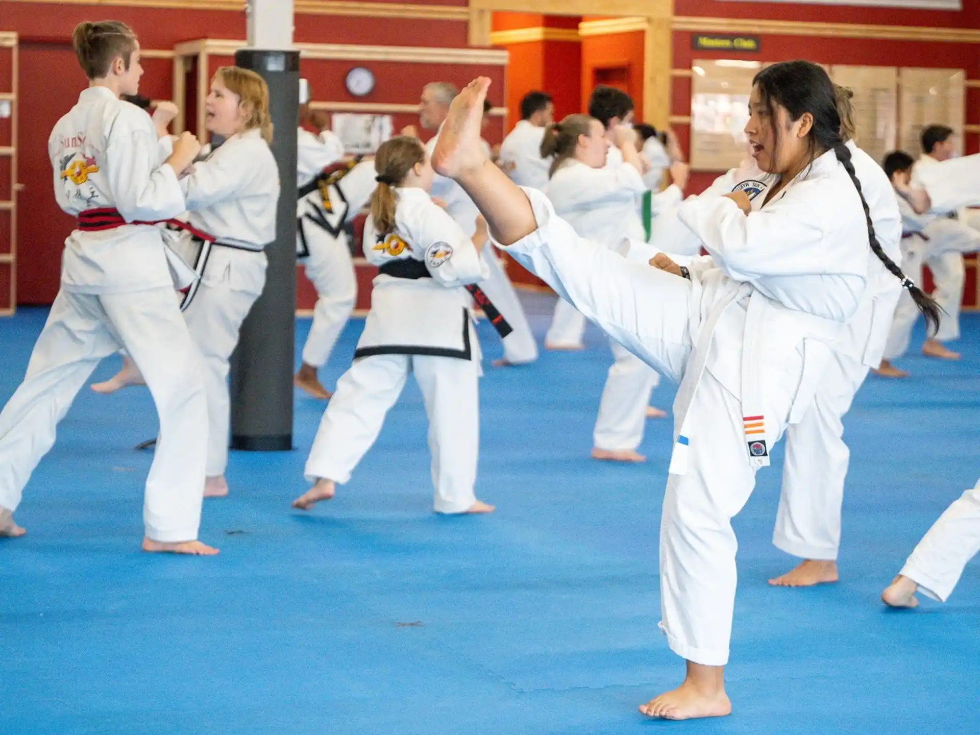 a group of people in karate uniforms