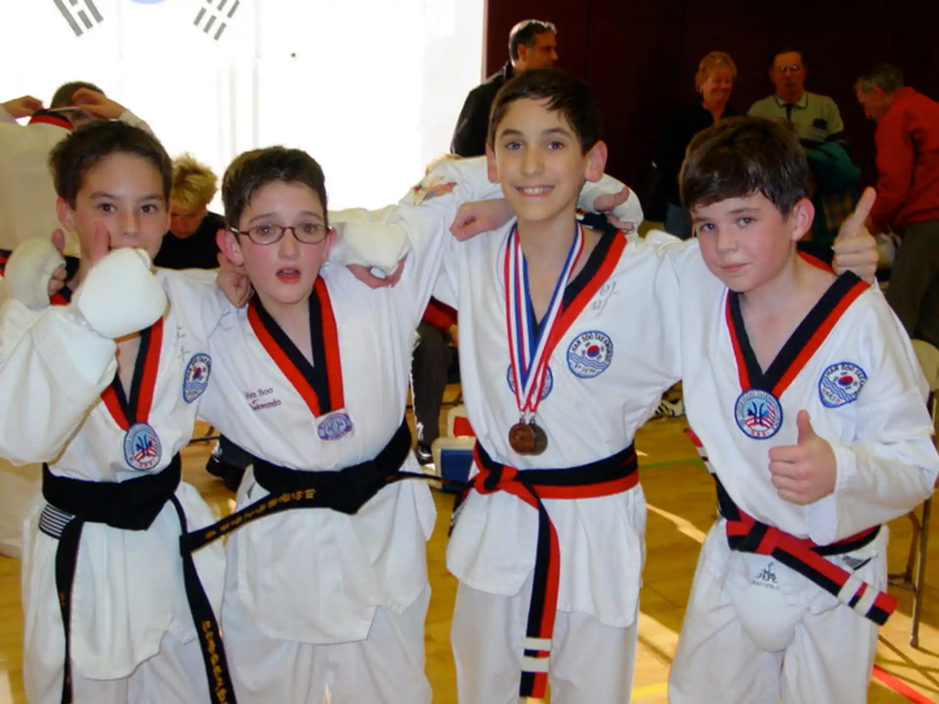 a group of boys in karate uniforms