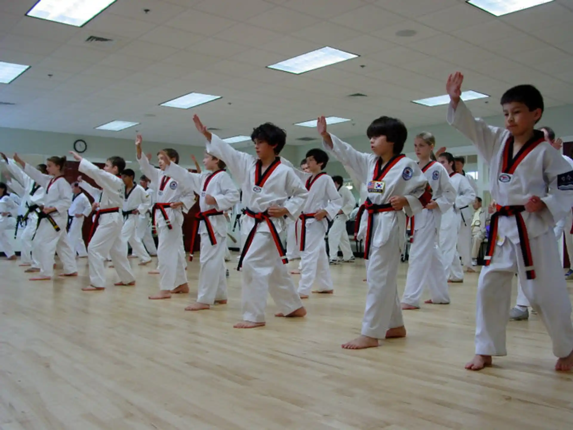 a group of people in karate uniforms