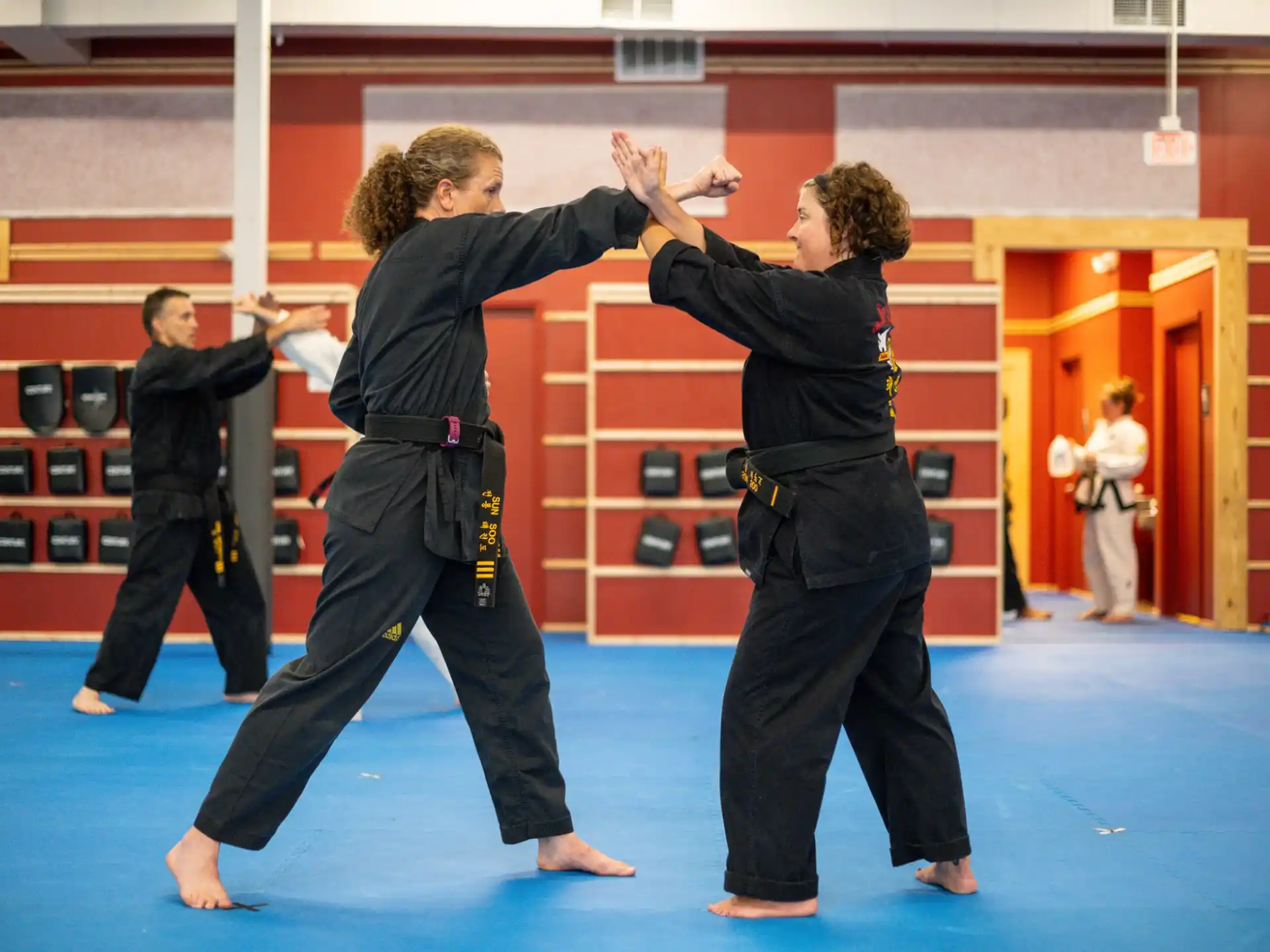 a group of people in a martial arts class