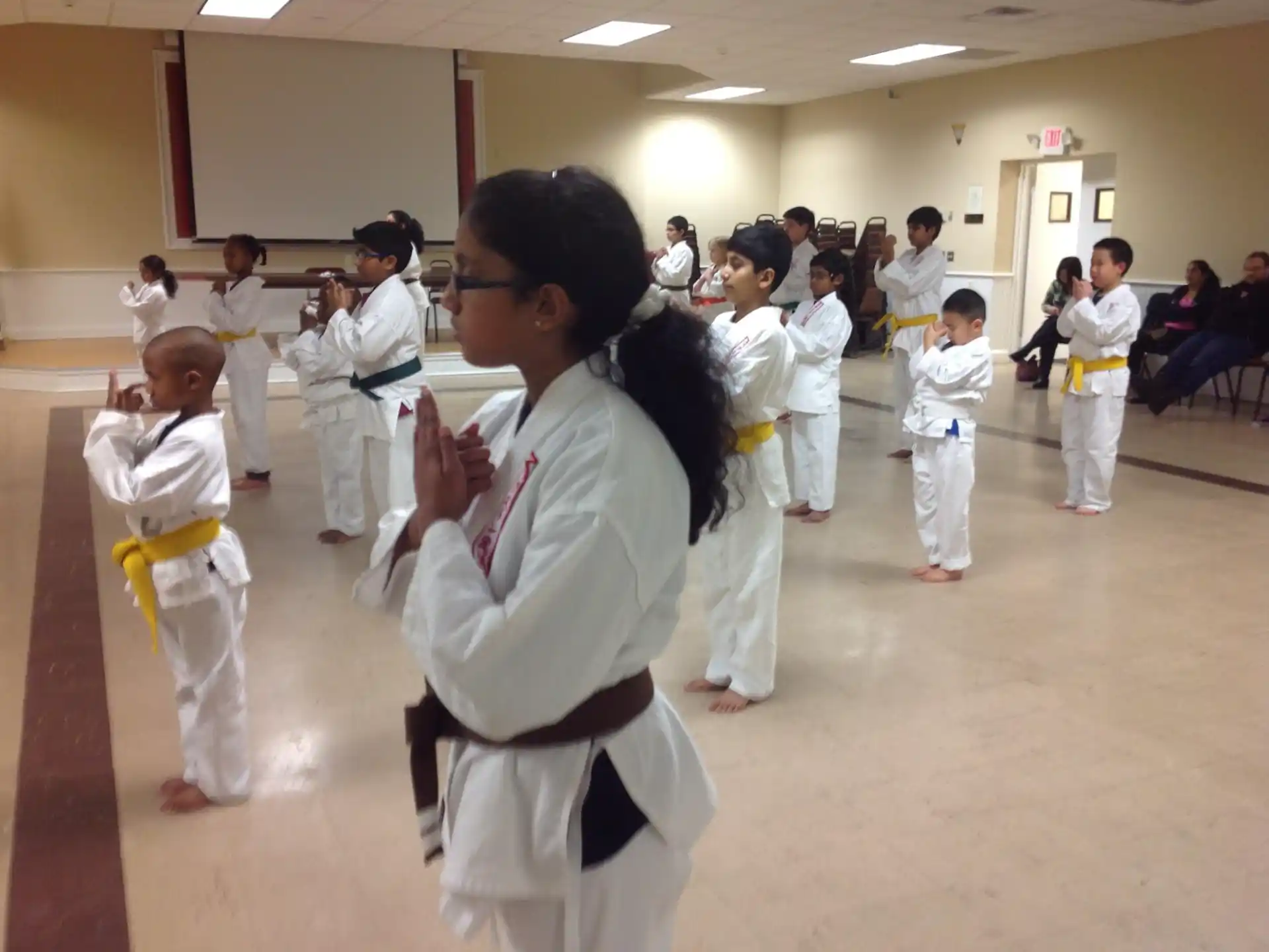 a group of people in karate uniforms