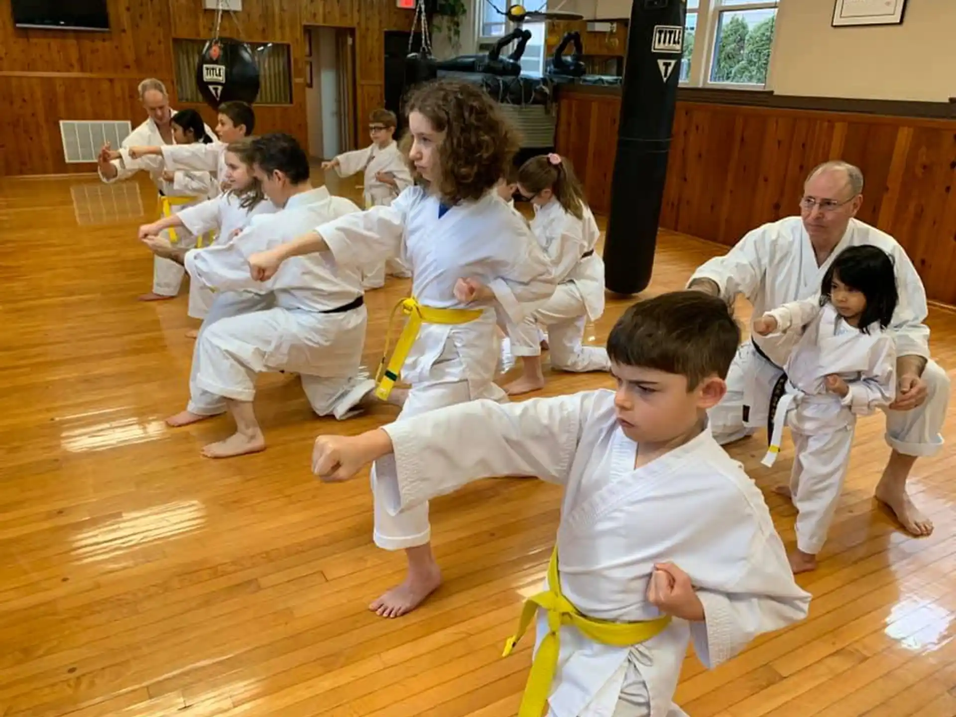 a group of people in karate uniforms