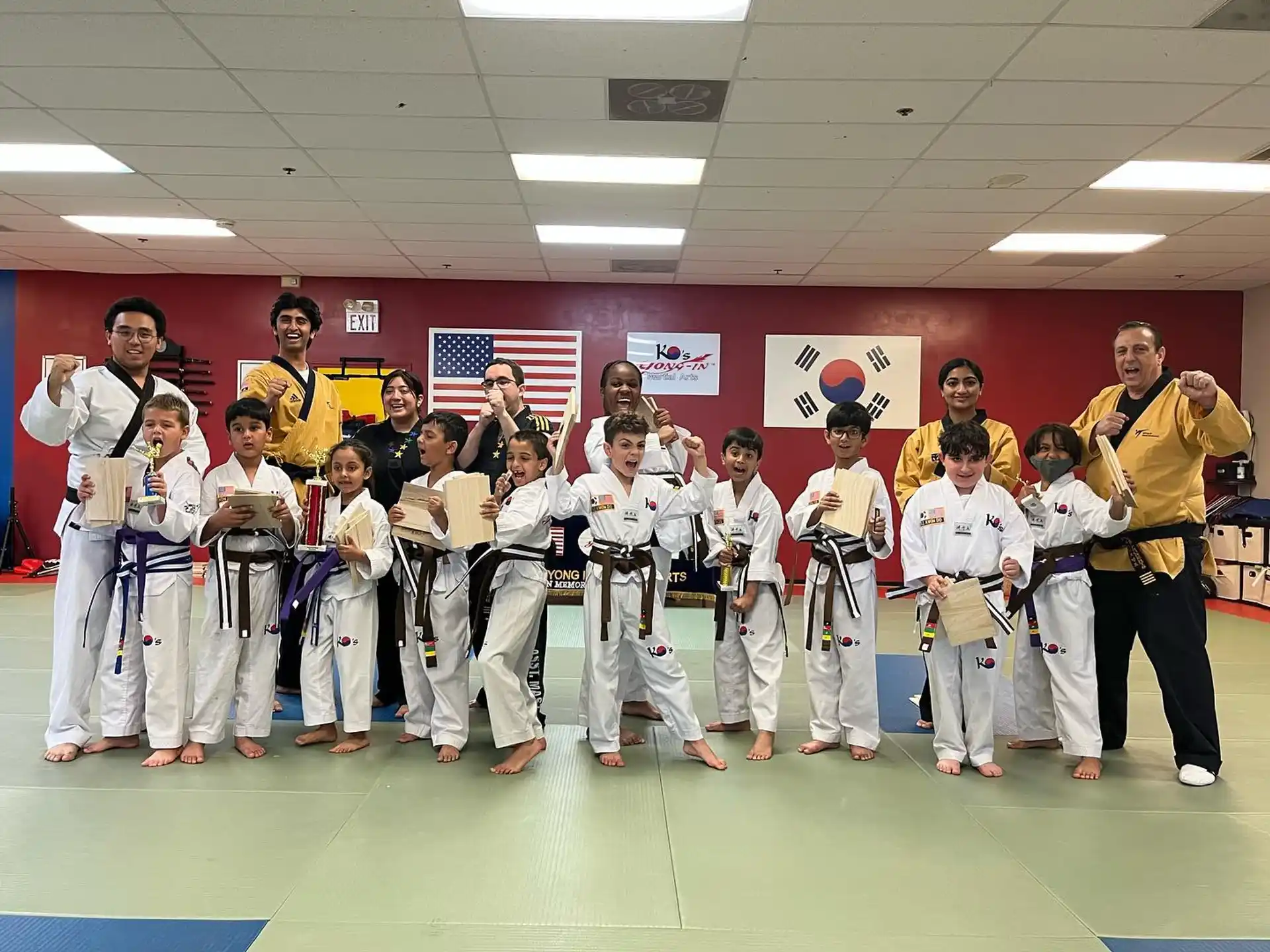 a group of people in karate uniforms
