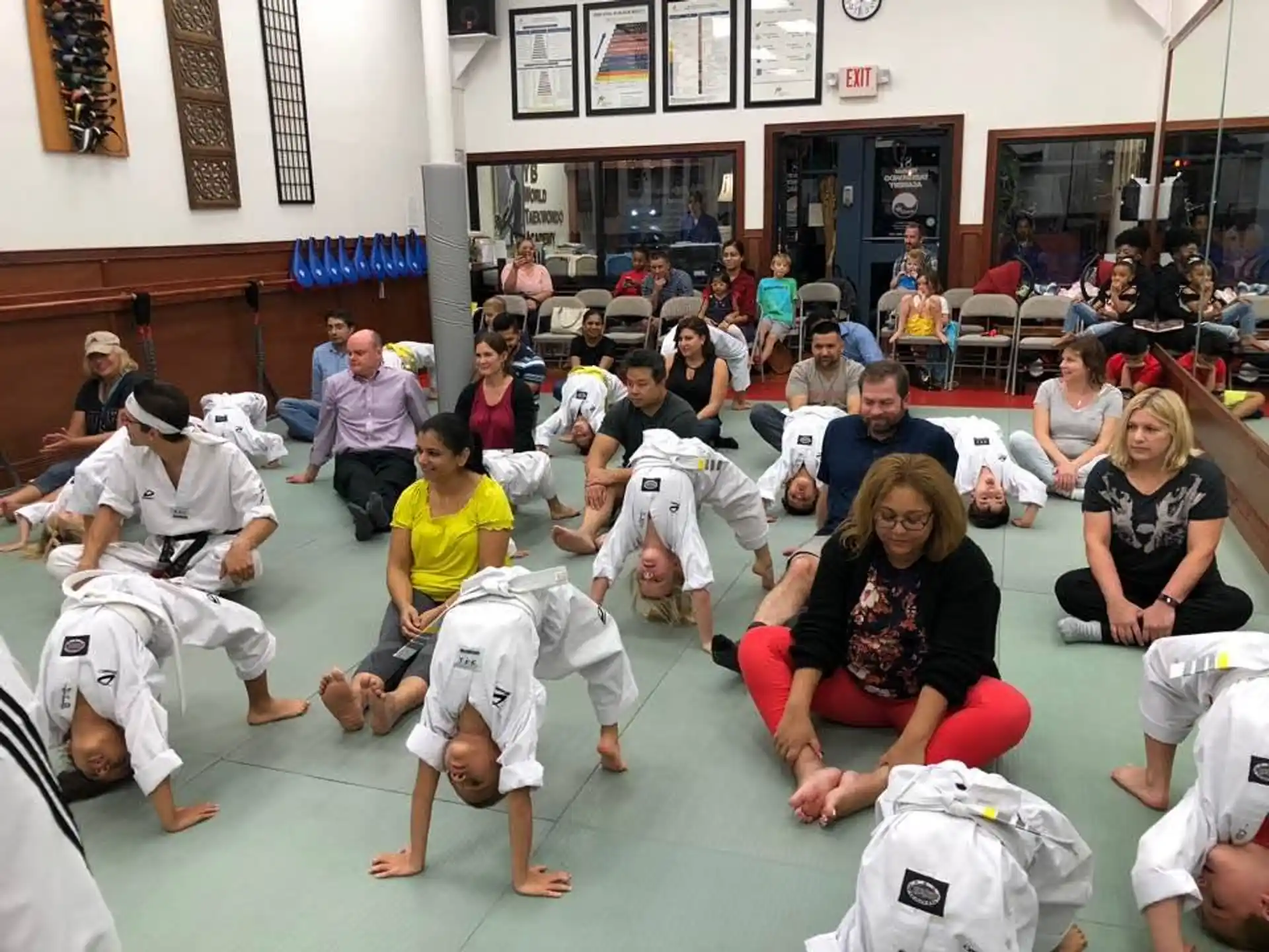 a group of people sitting on the floor