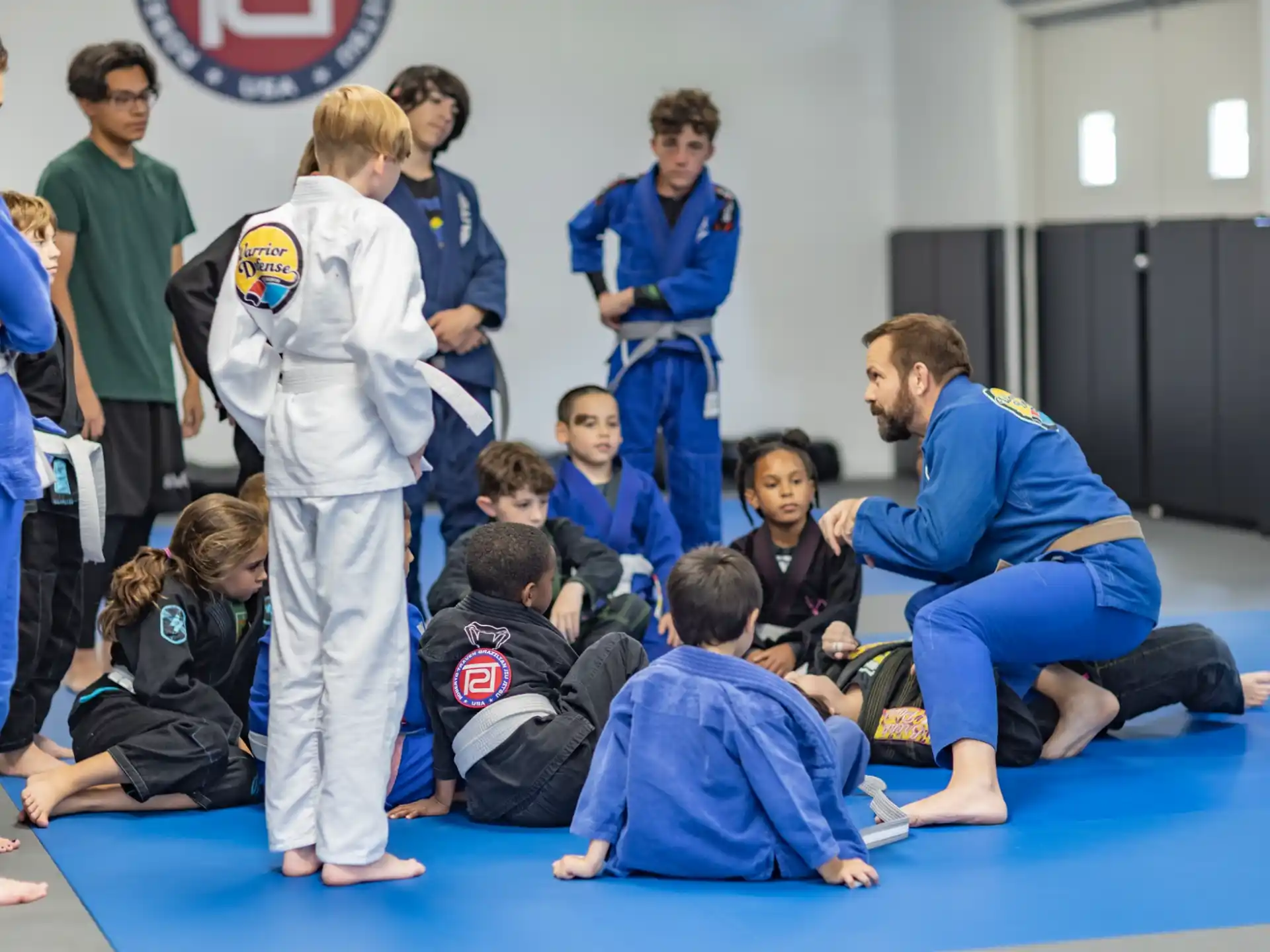 a group of people in karate uniforms