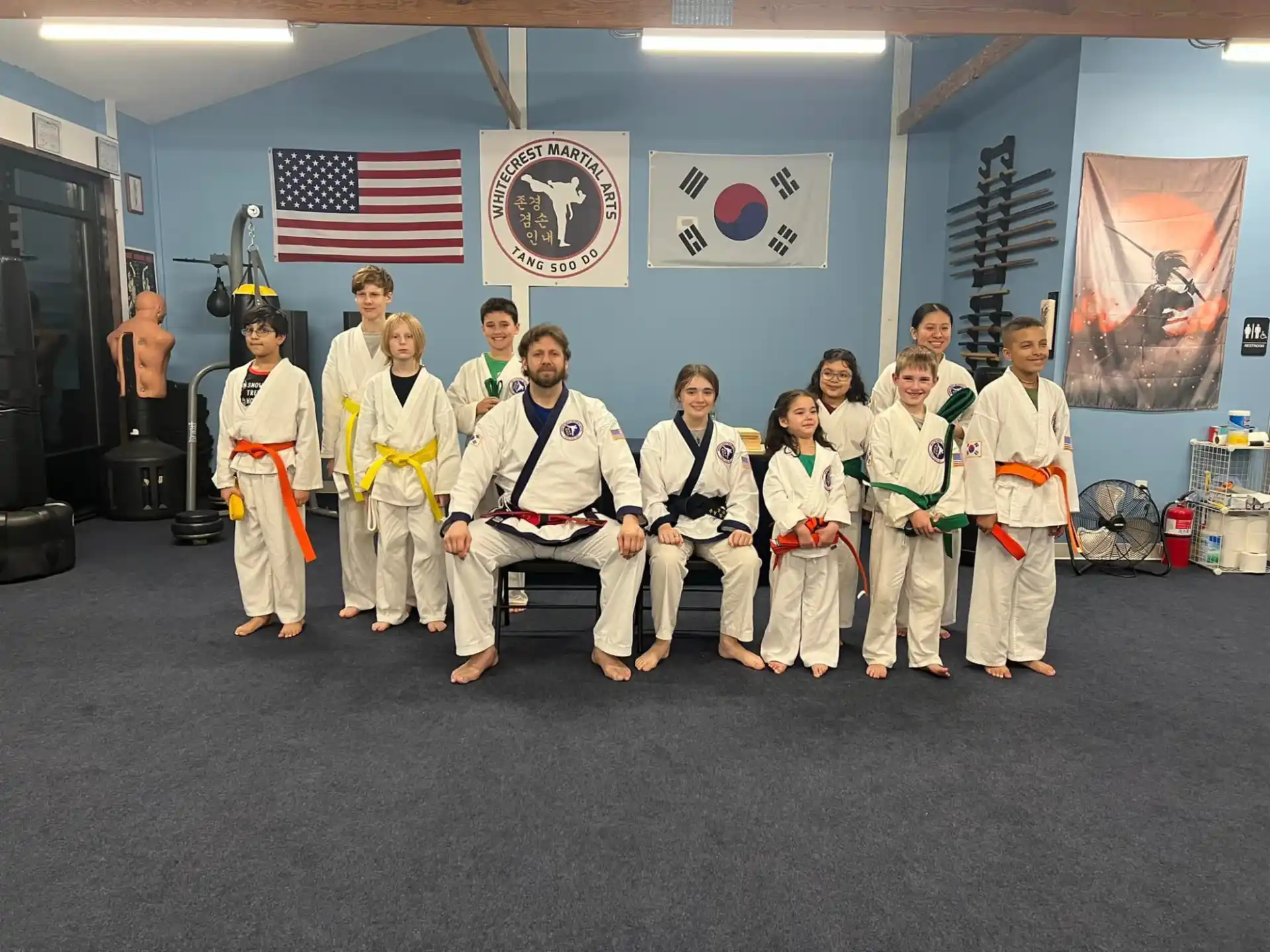 a group of people in karate uniforms