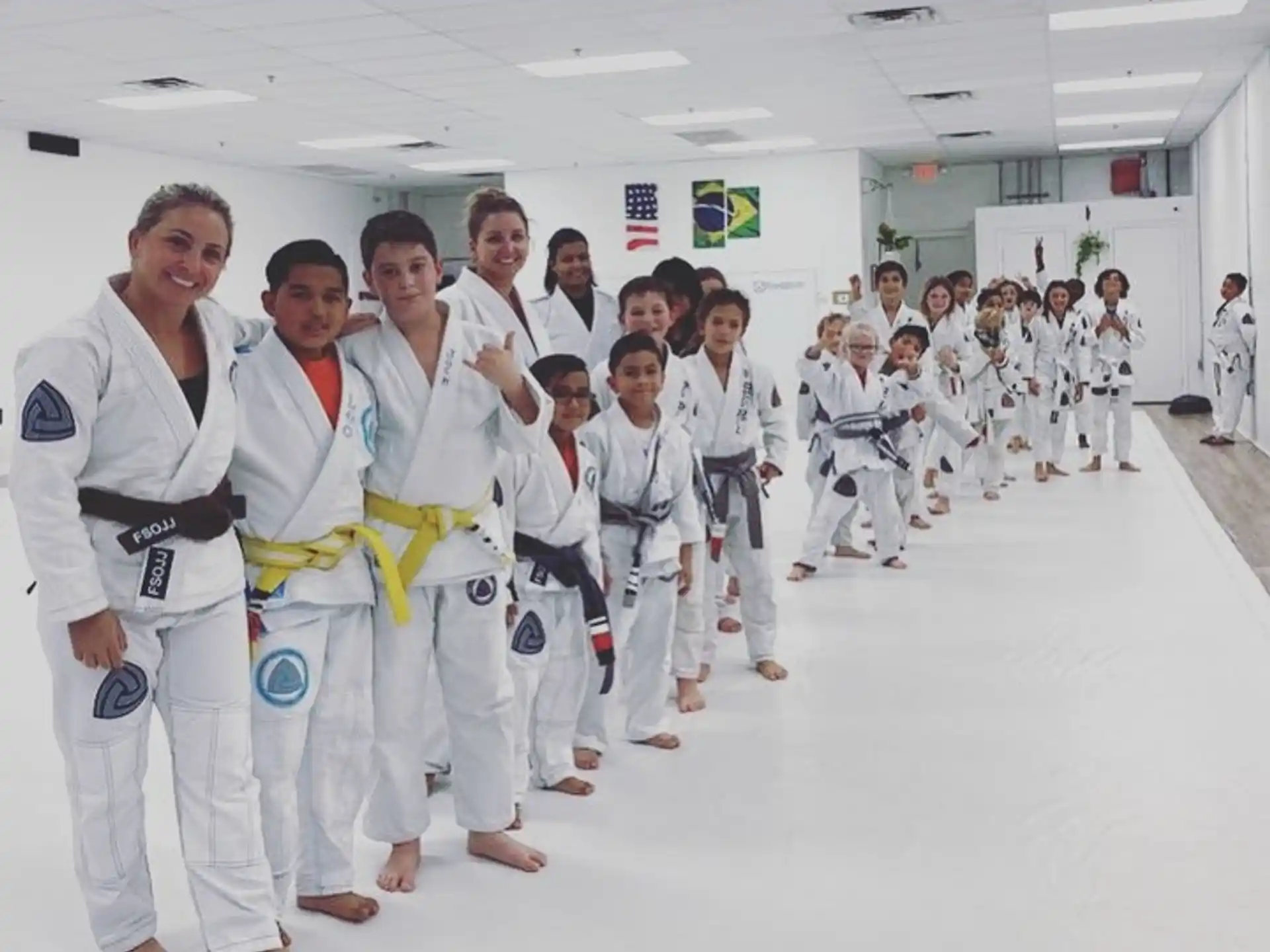a group of people in white karate uniforms