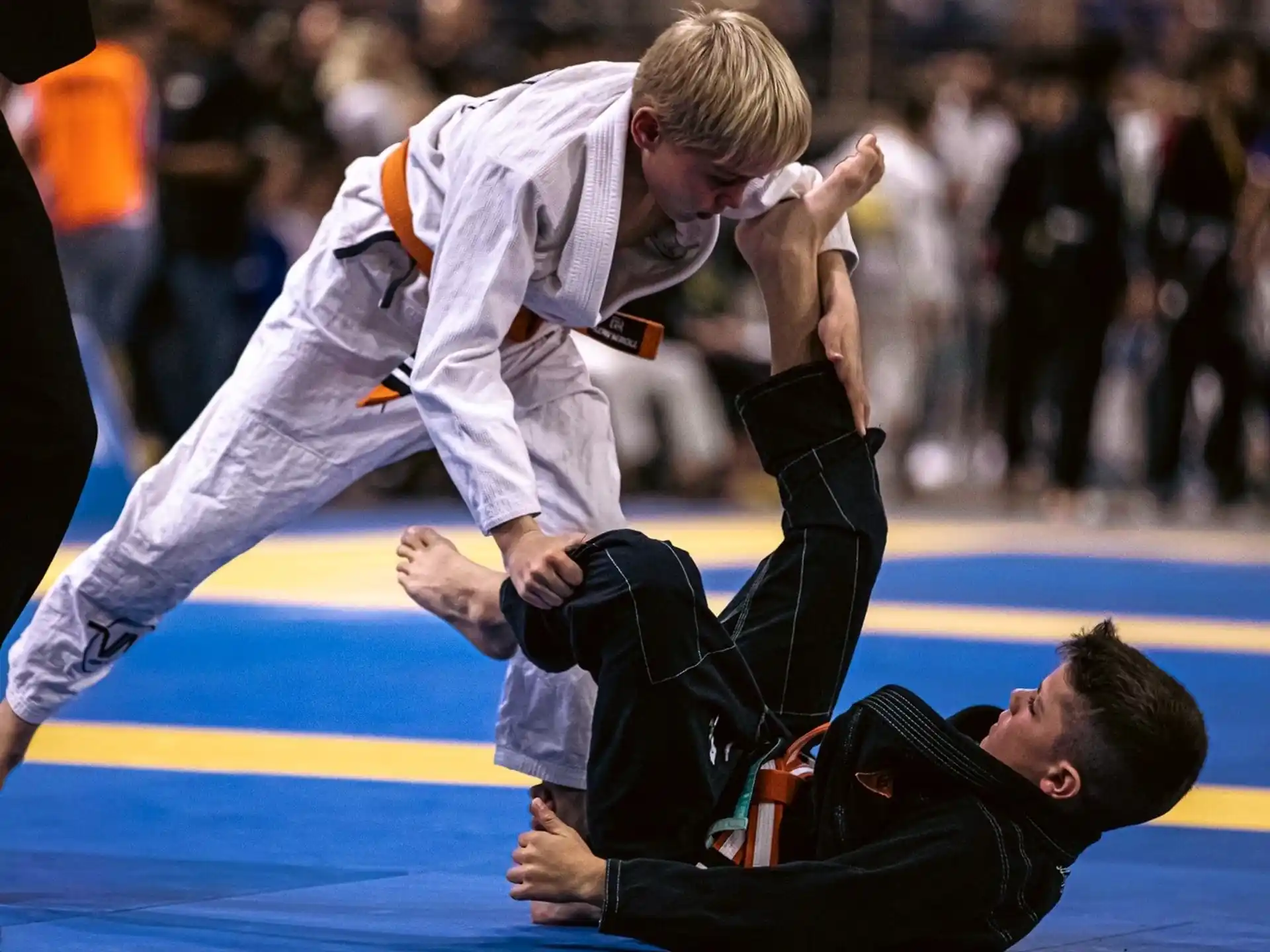 a man kicking another man