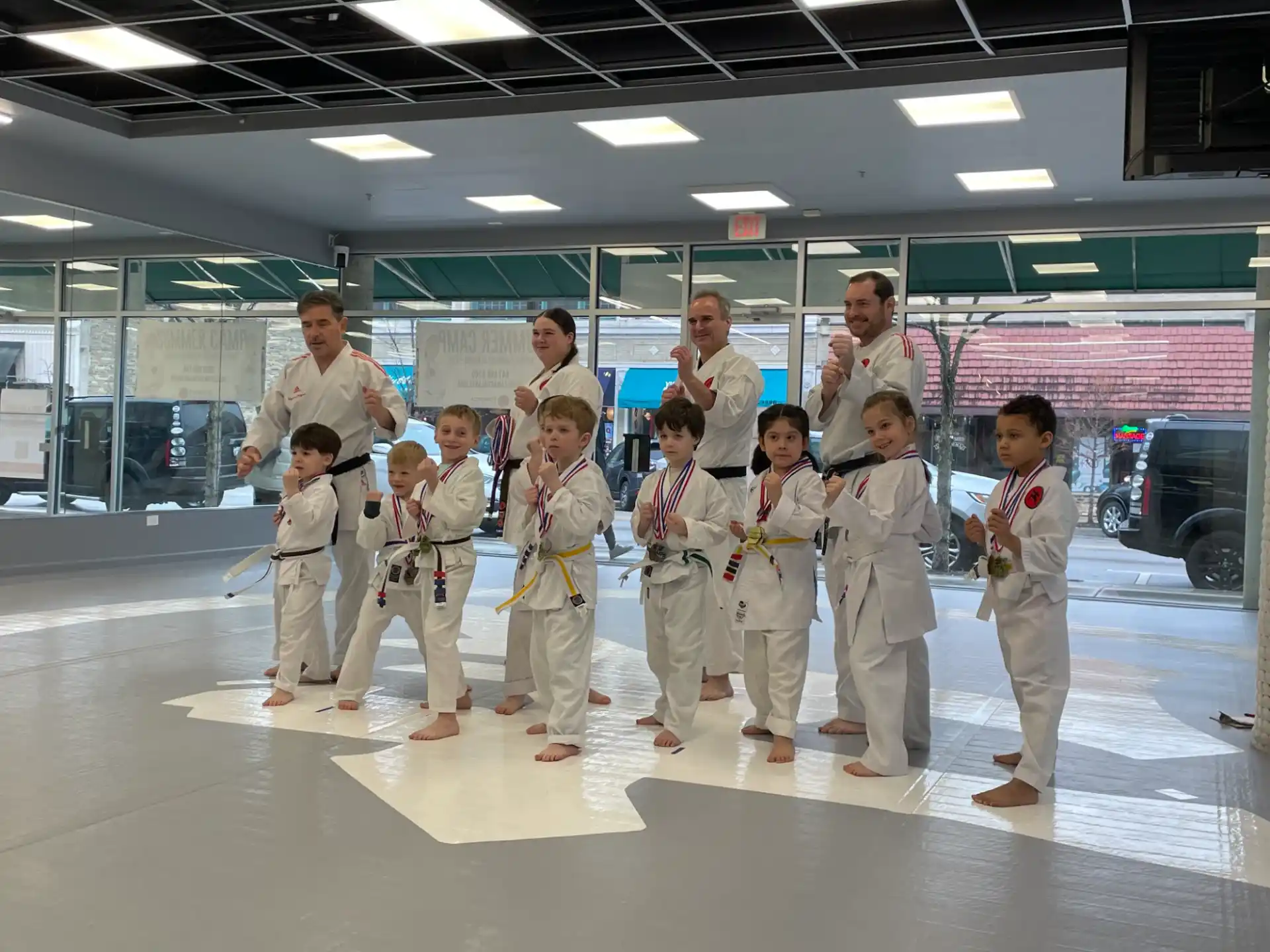 a group of people wearing white karate uniforms