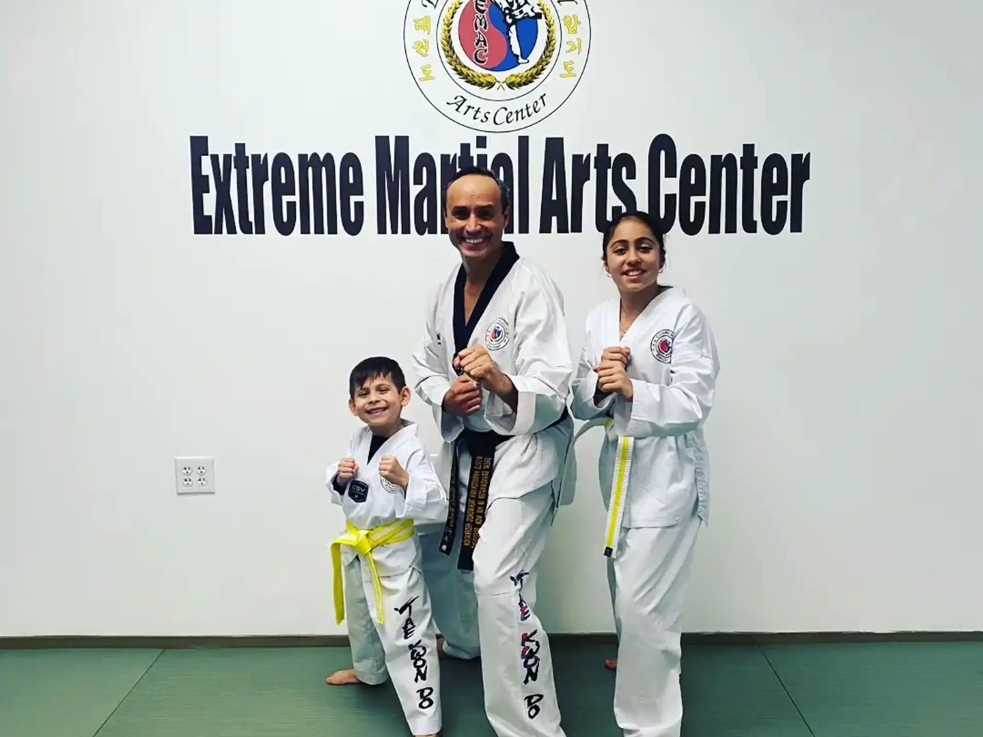 a group of people in karate uniforms