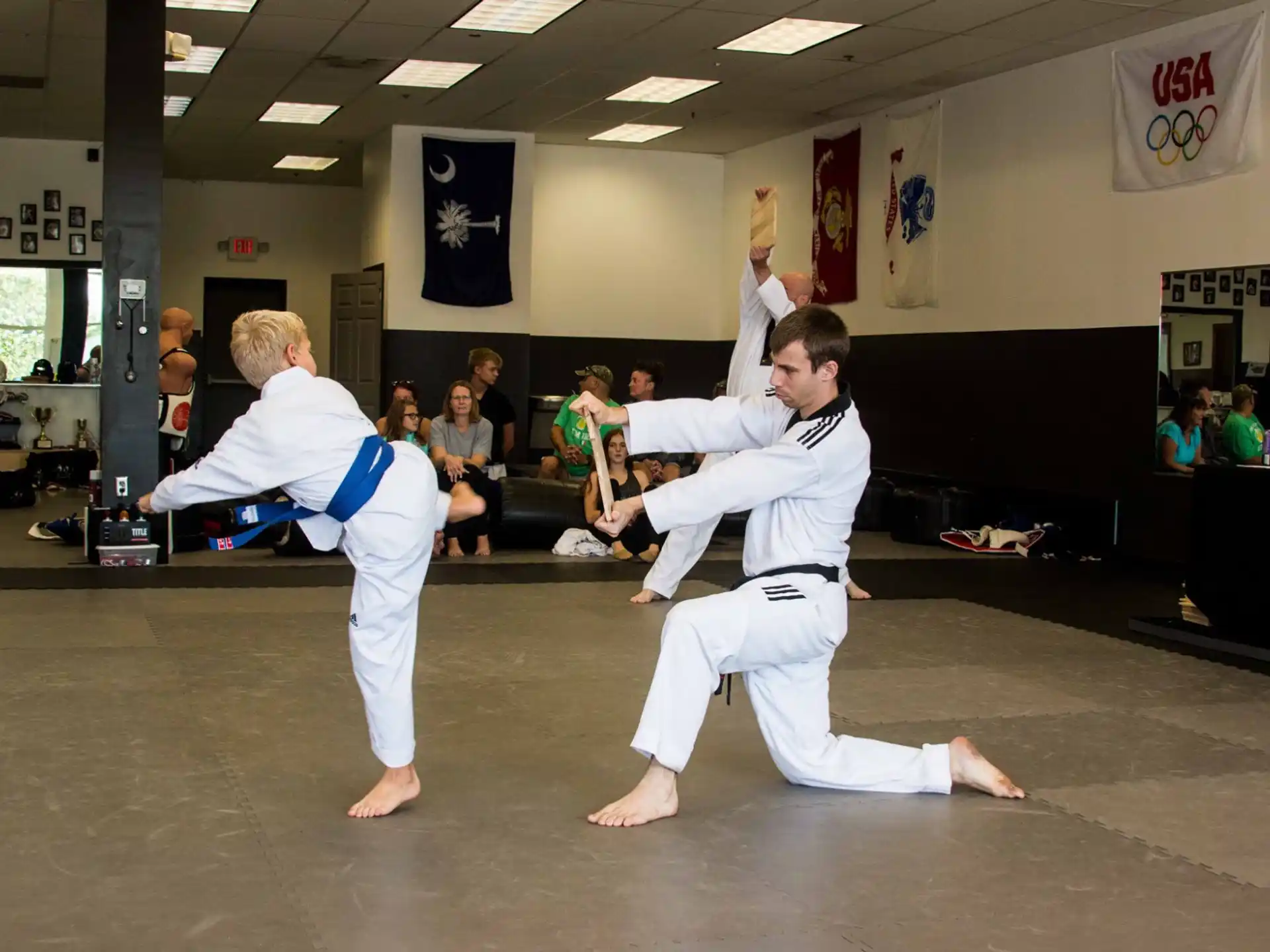 a couple of people in karate uniforms