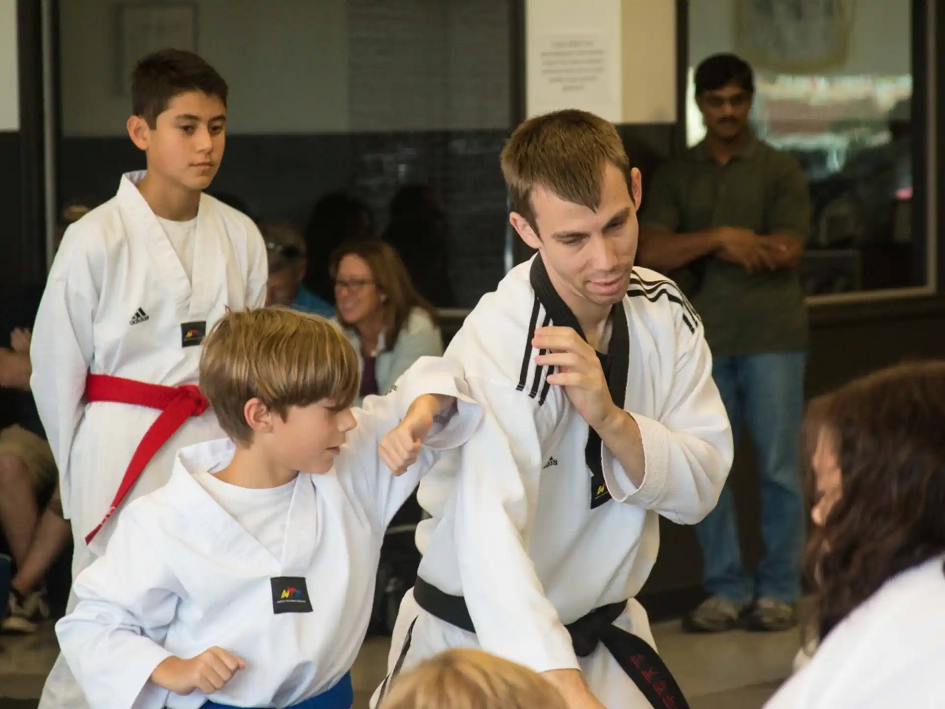 a group of people in karate uniforms