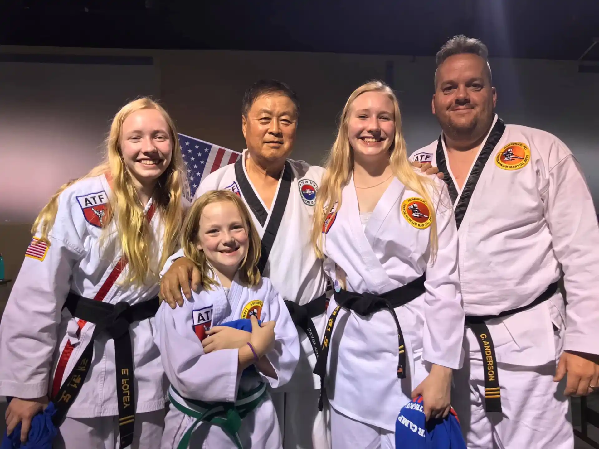 a group of people wearing medals
