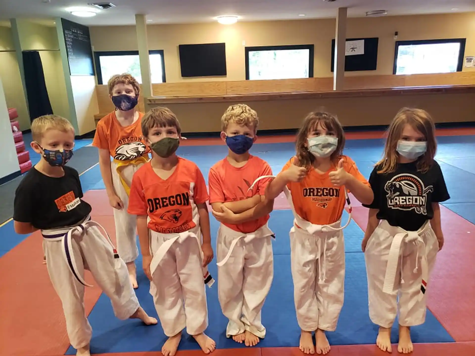 a group of kids wearing clothing