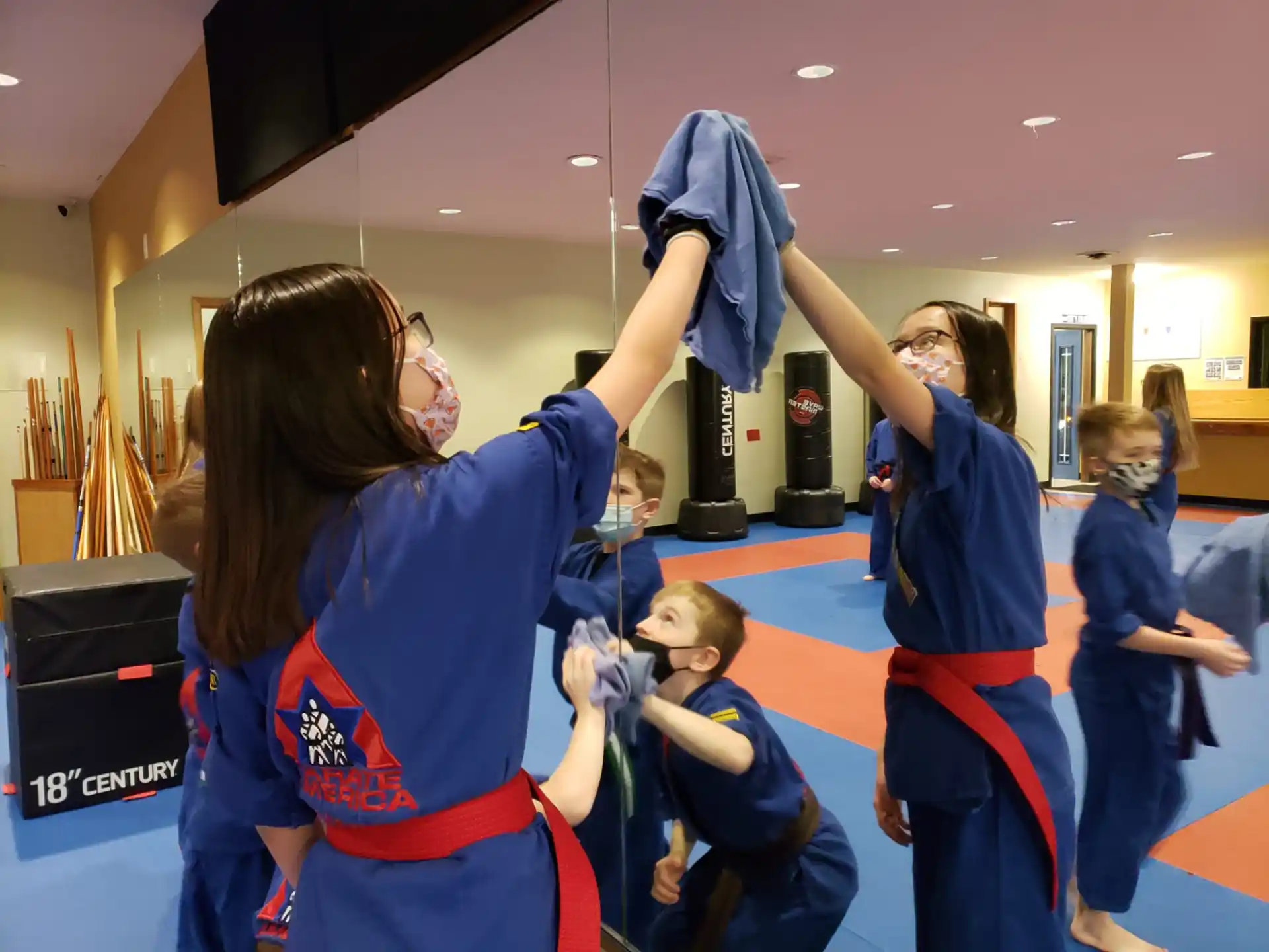 a group of people in blue karate uniforms