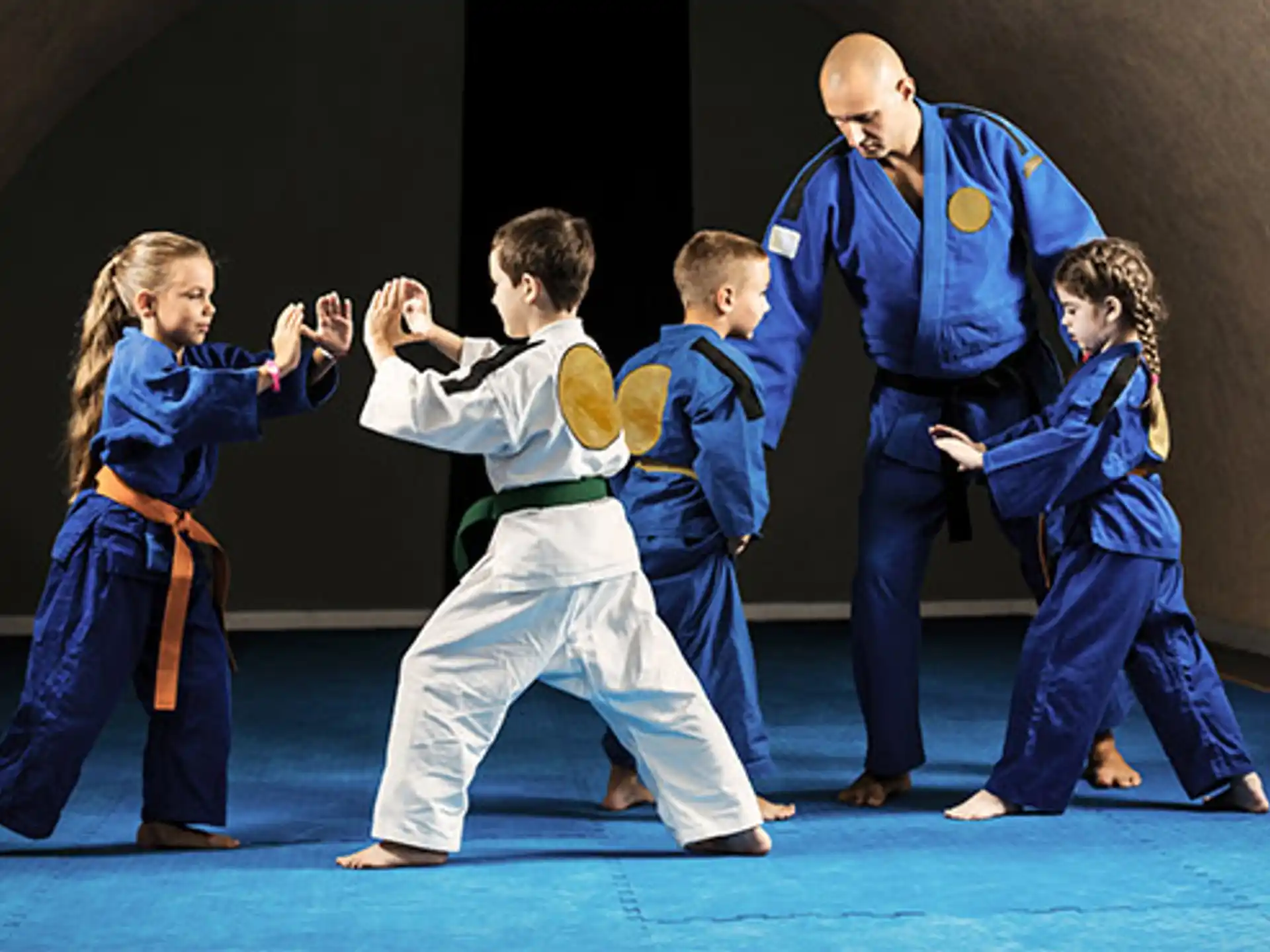a group of people in blue karate uniforms