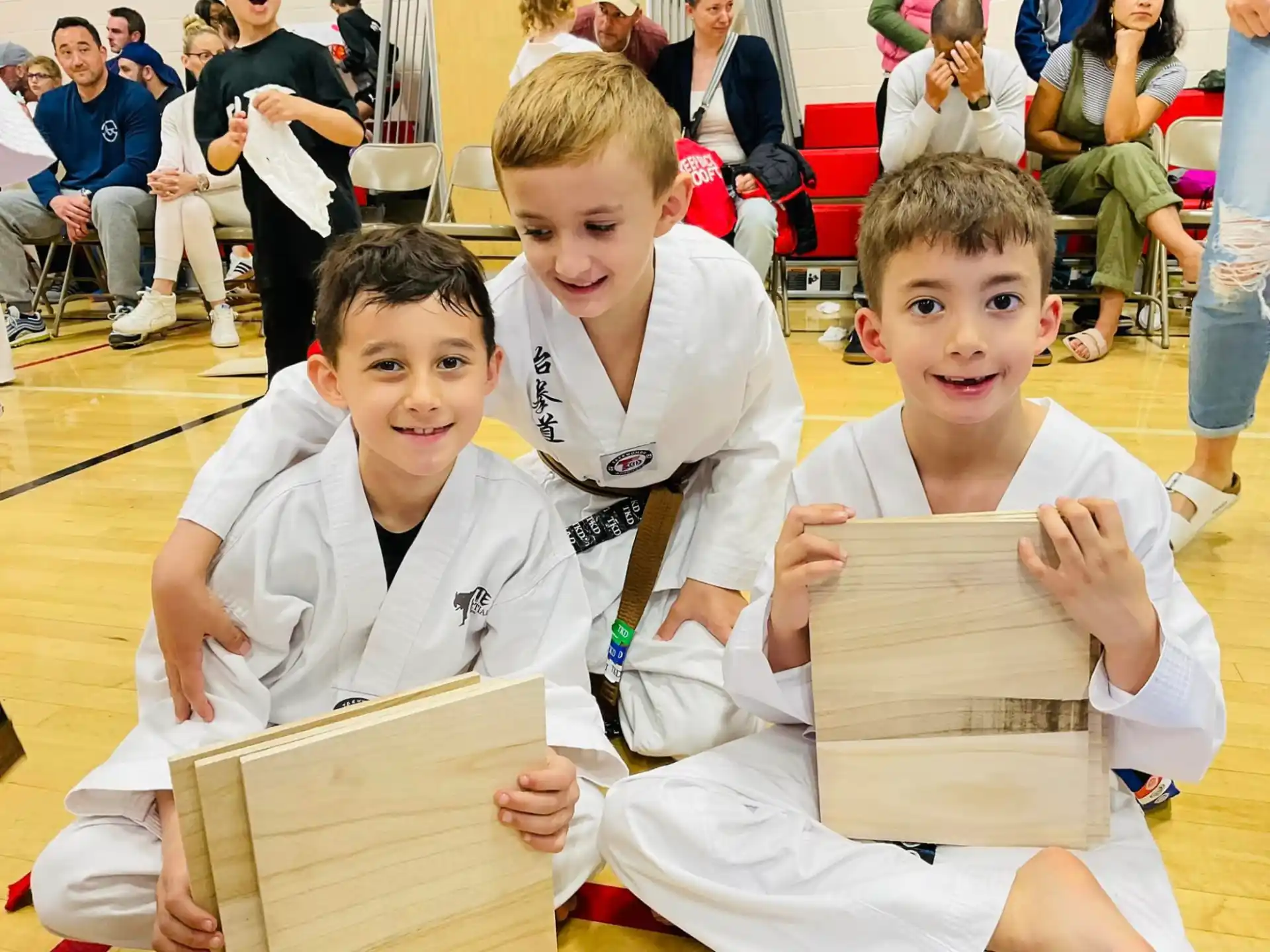 a group of boys in karate uniforms
