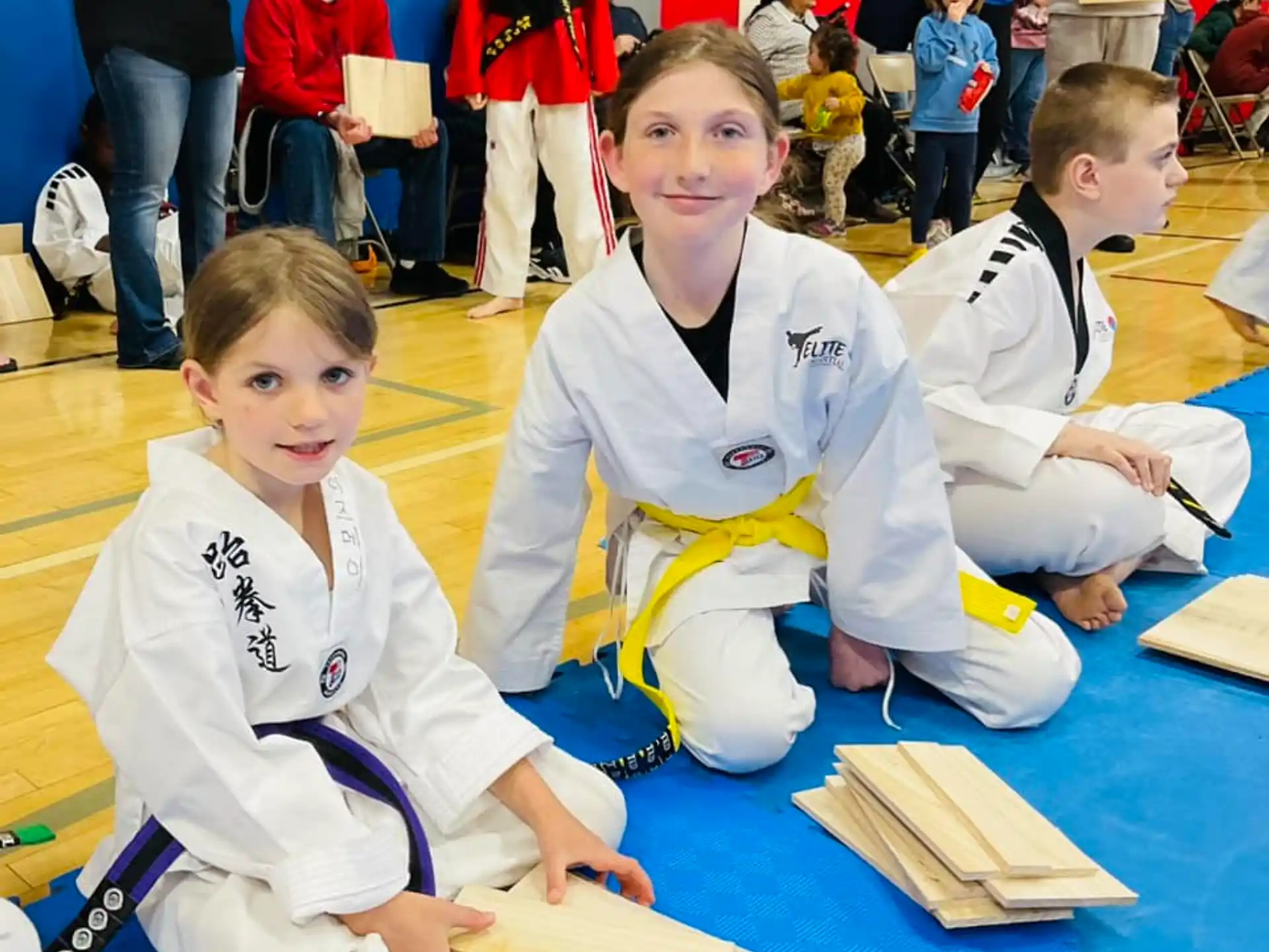 a group of people in karate uniforms