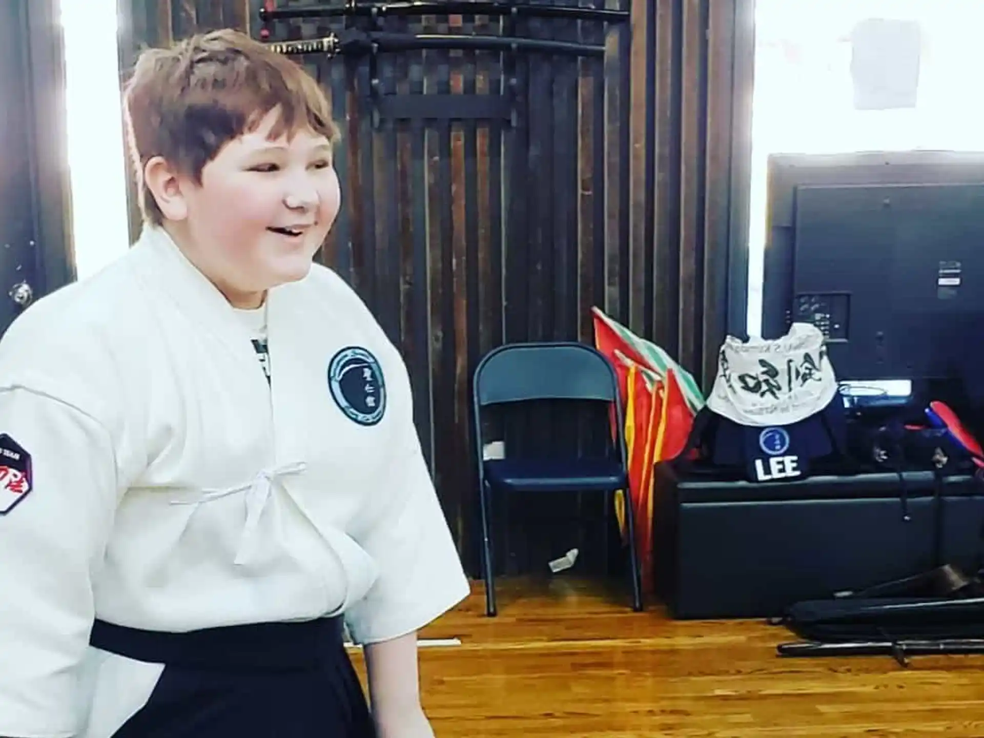 a boy in a karate uniform