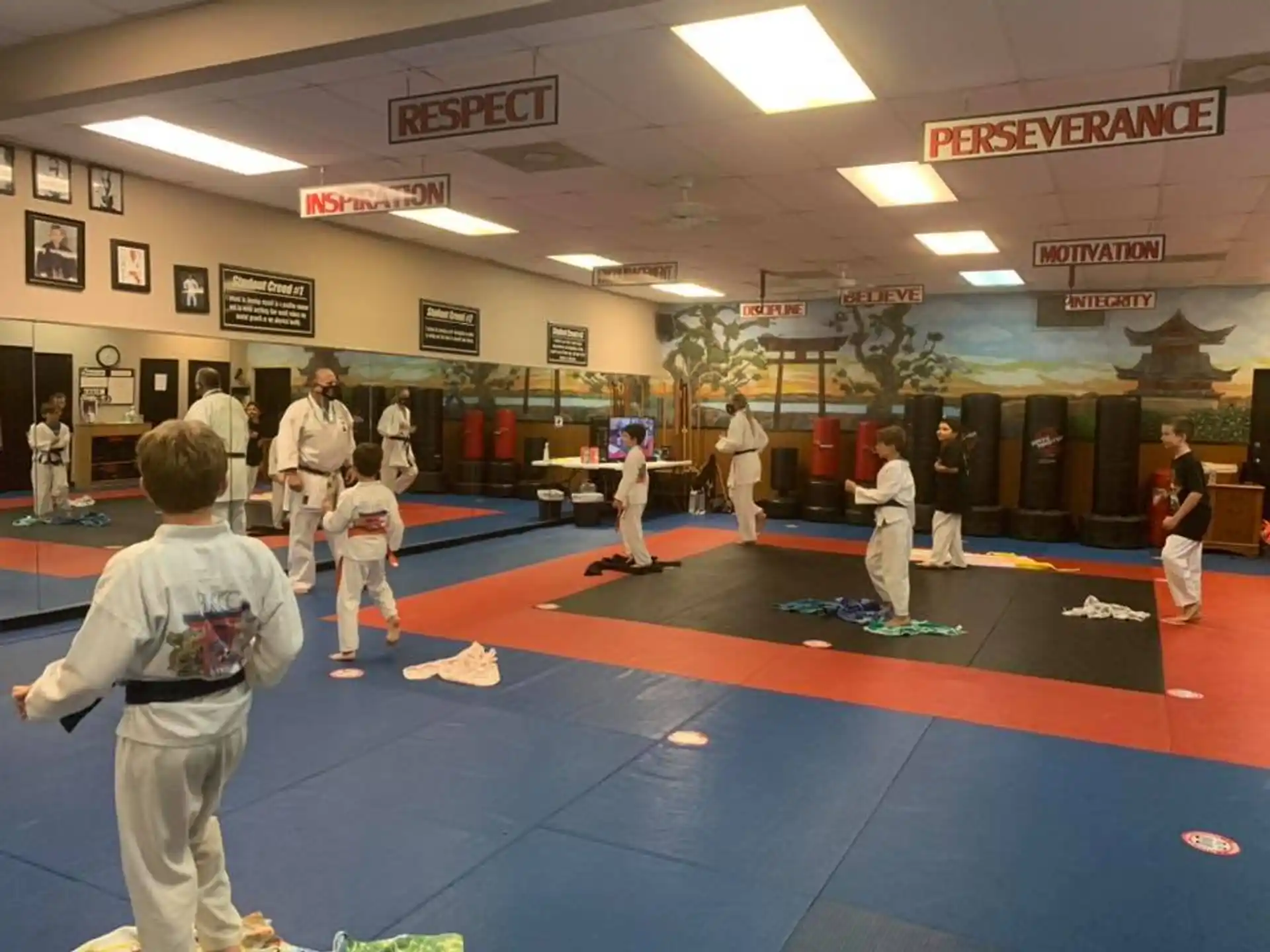a group of people in a karate class