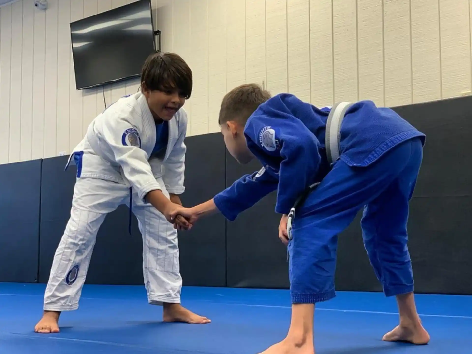 a group of boys in karate uniforms
