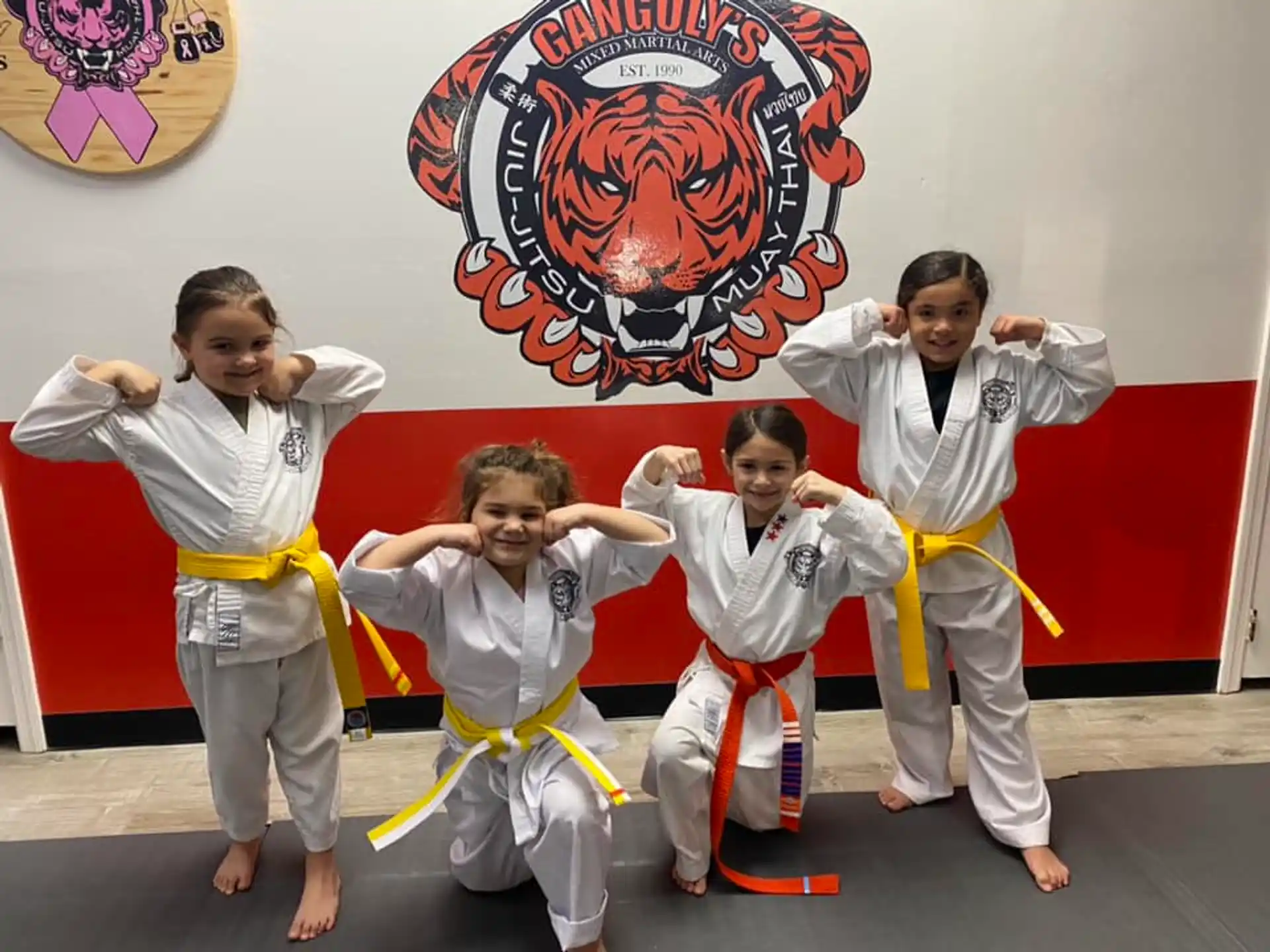 a group of boys in karate uniforms